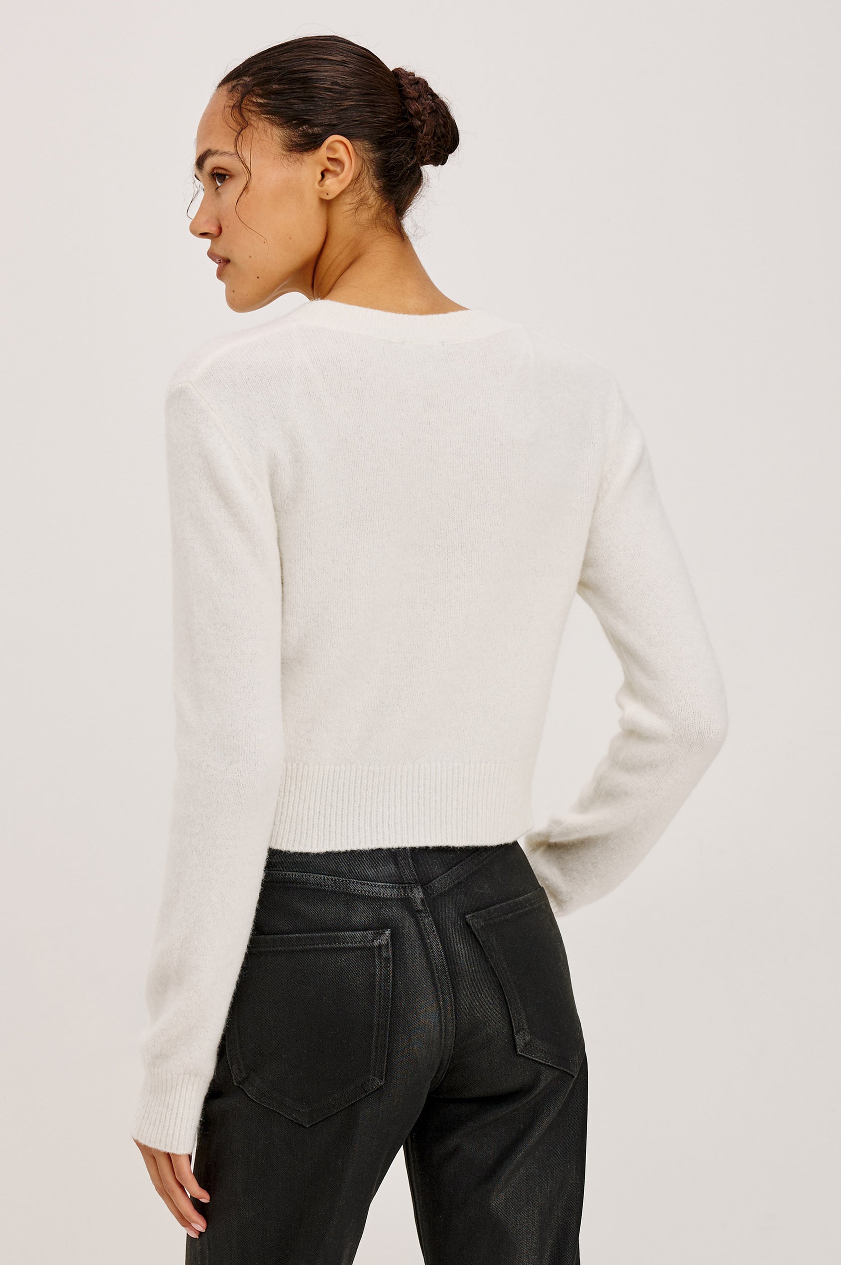 Matilda Cardigan in Wool-Blend Knit WIth Relaxed Slightly Cropped Fit, Crew Neck, Front Buttons, and Ribbed Trim in Ivory Colorway - Upper Body Back View Featured on Model