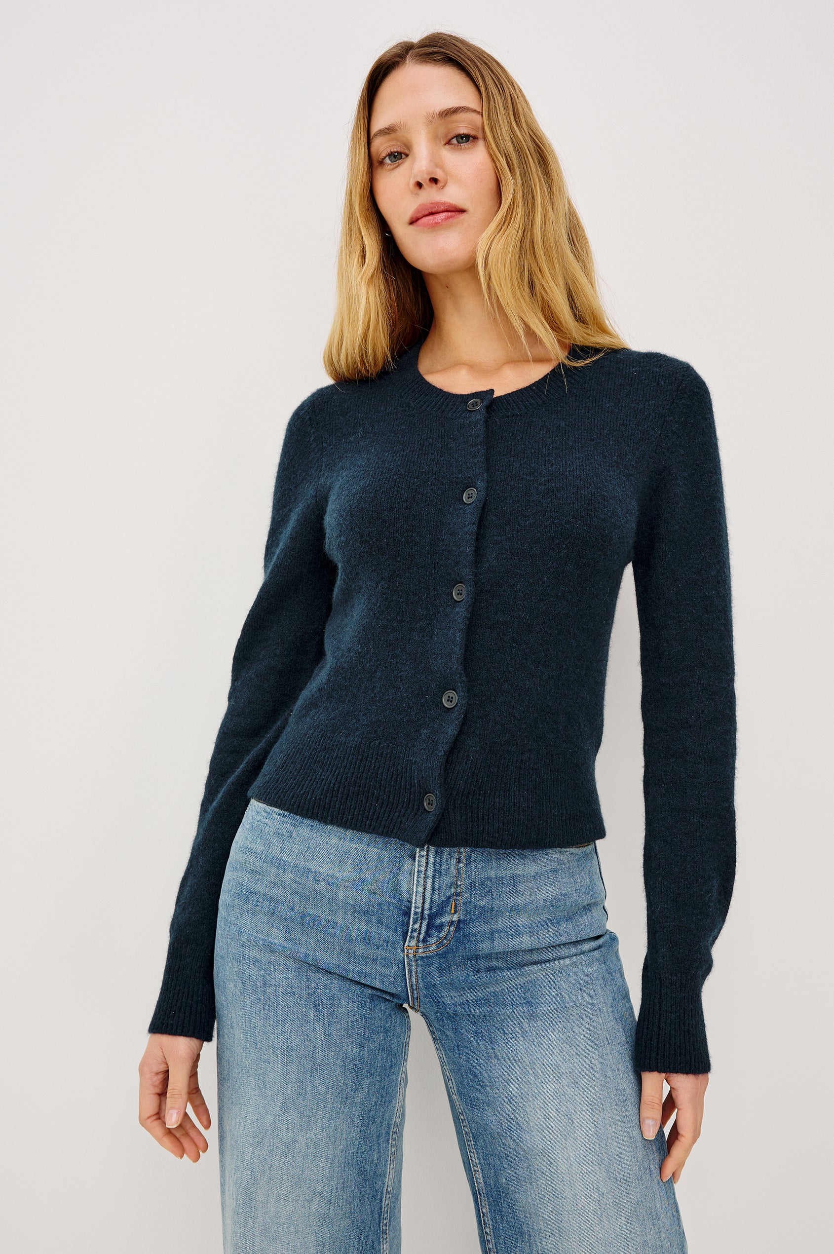 Matilda Cropped Long-Sleeve Sweater with Button Closure Crew Neck and Ribbed Trim in Navy Colorway - Front View Featured on Model