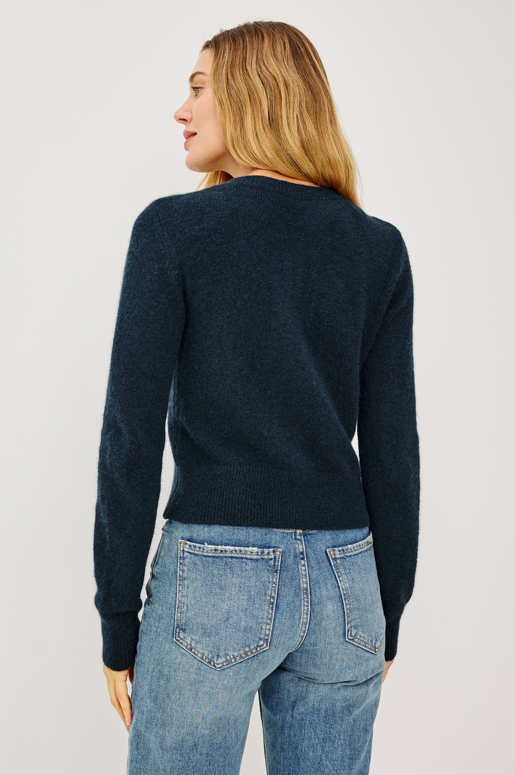 Matilda Cropped Long-Sleeve Sweater with Button Closure Crew Neck and Ribbed Trim in Navy Colorway - Front View Featured on Model