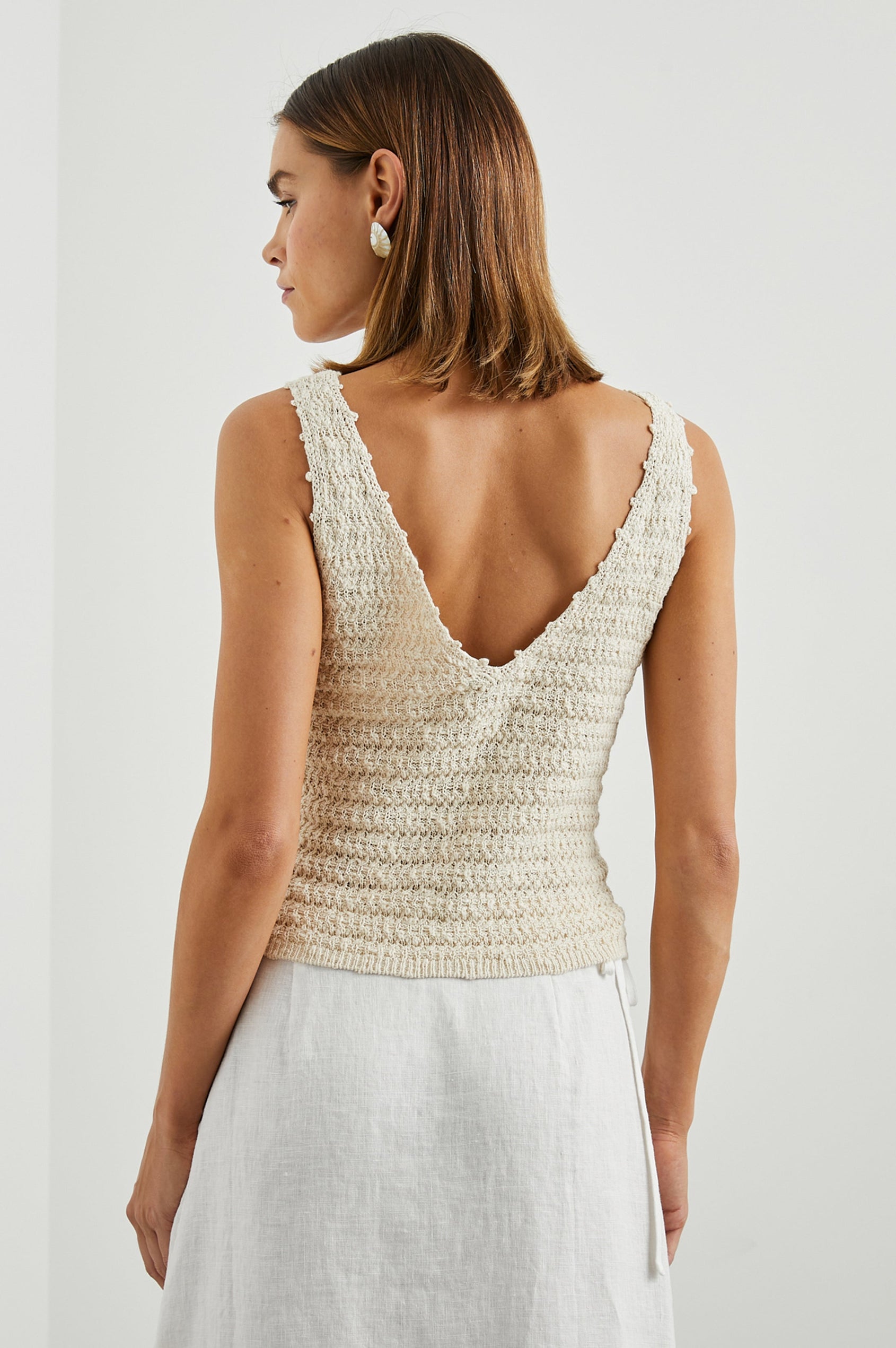 Matilde Crop Knit Tank with a V Neck in Oat Colorway - Back View Featured on Model  