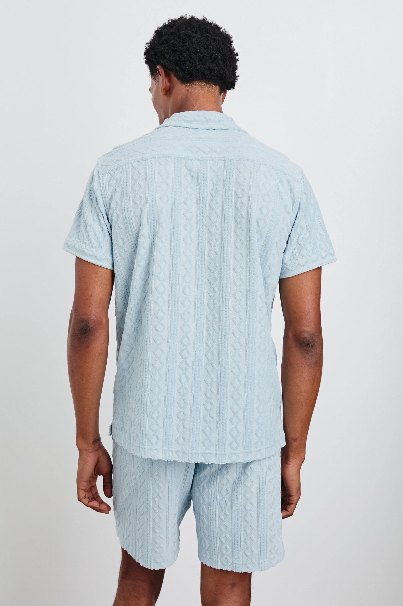 Maverick Short Sleeve Button Up with a raised jacquard pattern in Coastal Blue Colorway - Back View Featured on Model