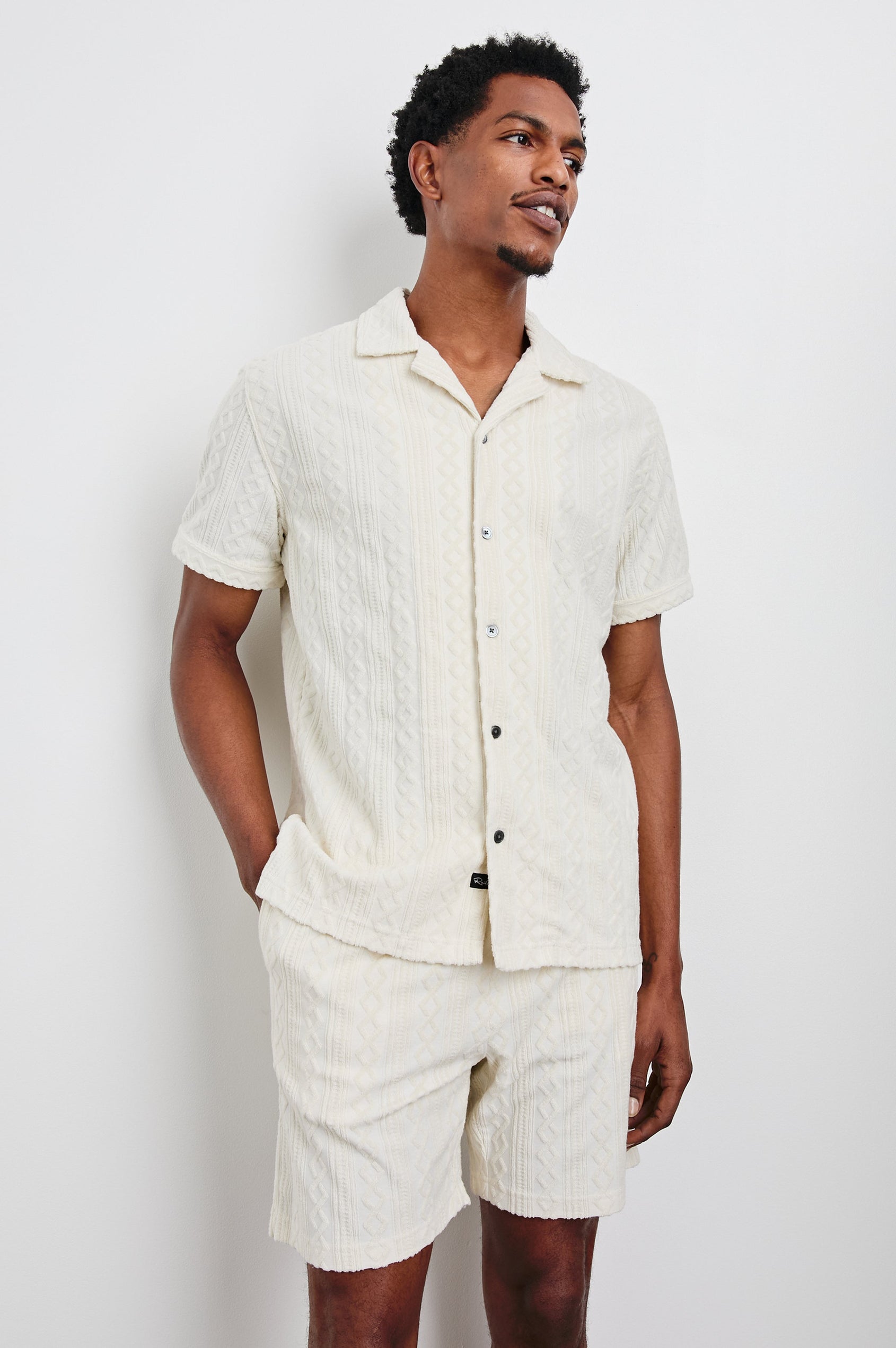Maverick Short Sleeve Button Up with a raised jacquard pattern in Ecru Colorway - Front View Featured on Model