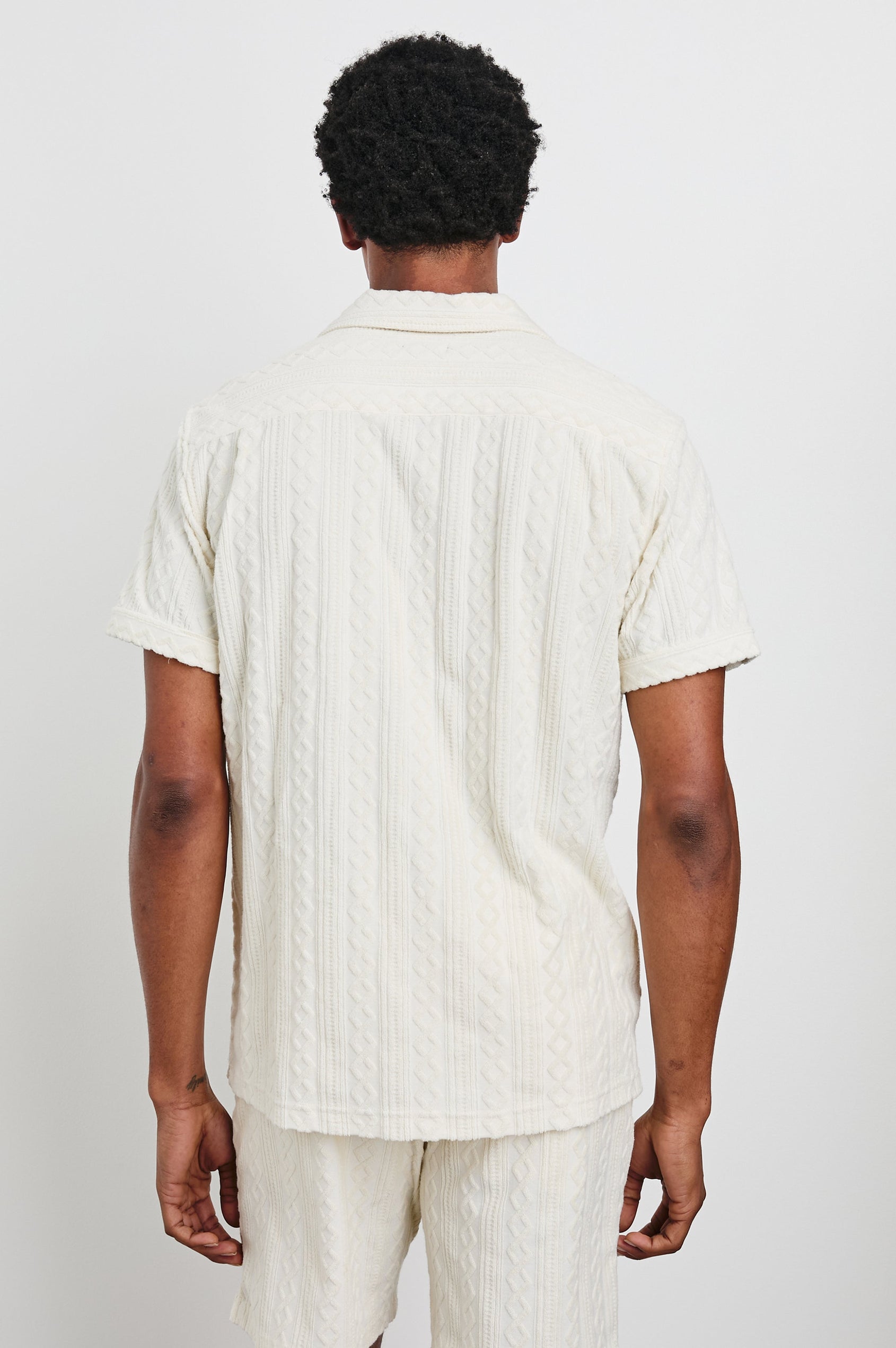 Maverick Short Sleeve Button Up with a raised jacquard pattern in Ecru Colorway - Back View Featured on Model