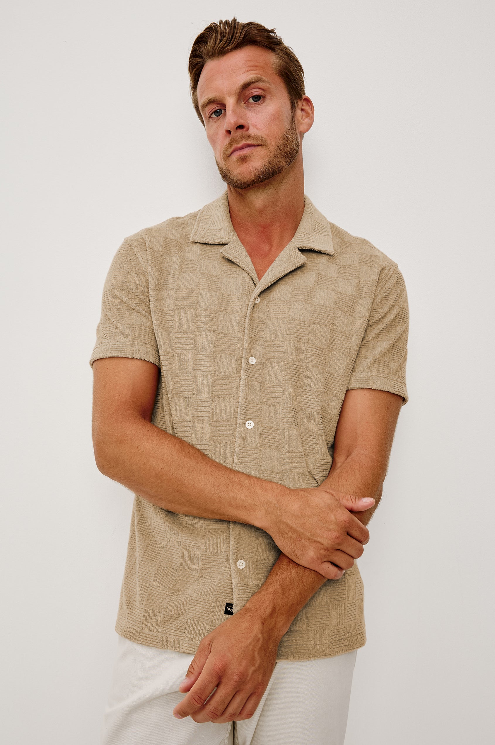 Maverick Short Sleeve Shirt in French Terry With Jacquard Pattern, Notched Collar, Front Buttons, and Classic Fit in Grange Craft Paper Colorway - Upper Body Front View Featured on Model