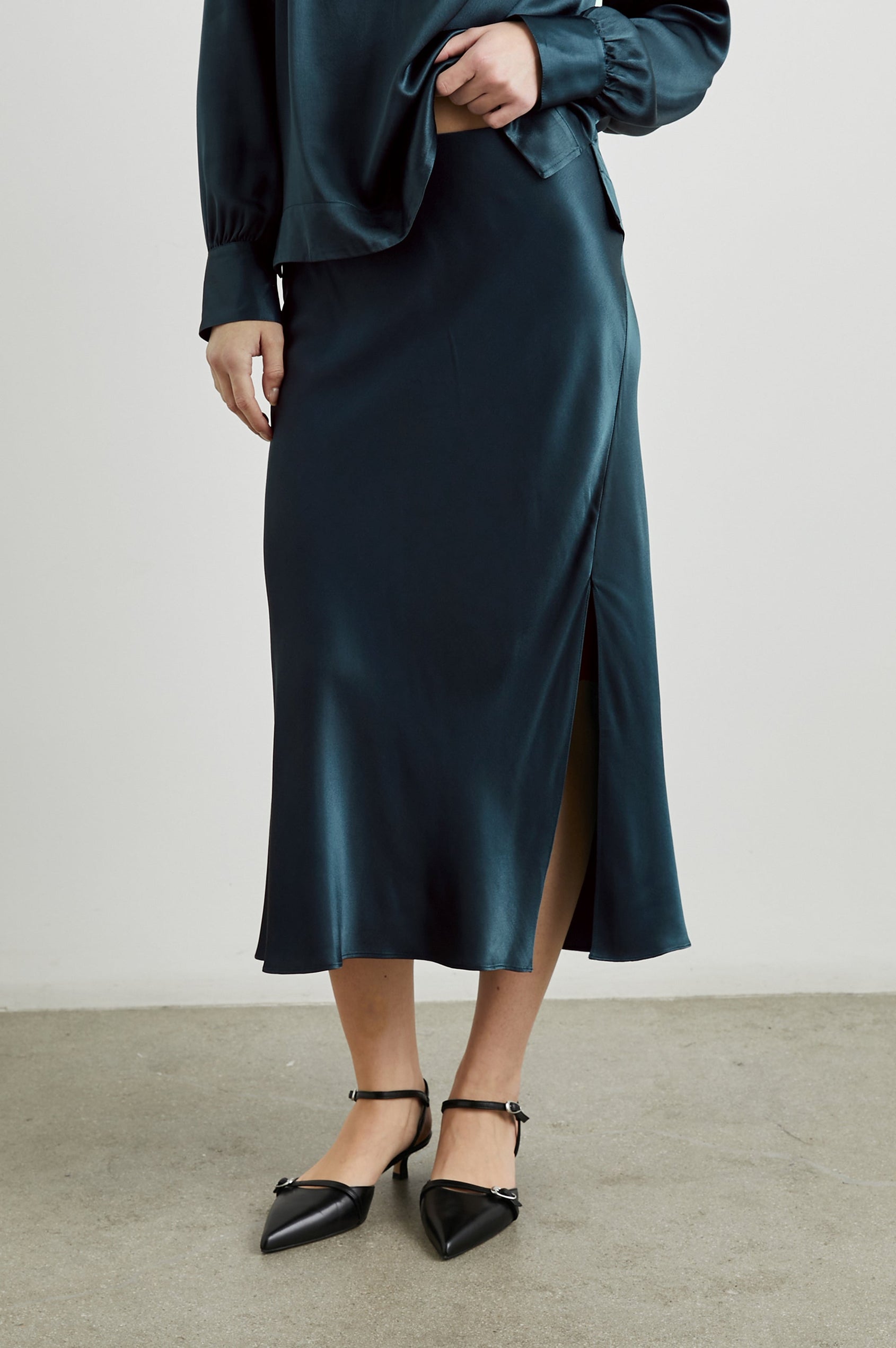 Maya Midi Skirt with Mid-Thigh Side Slit in Deep Sea Colorway - Front View Featured on Model