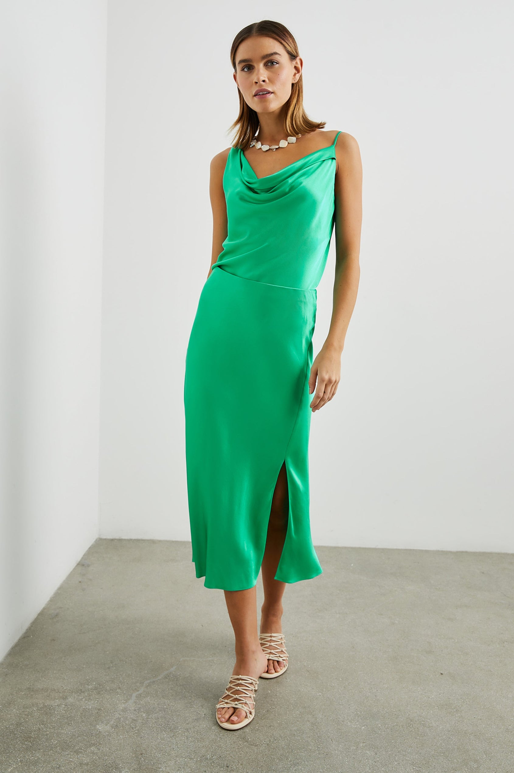 Maya Midi Skirt with Mid-Thigh Side Slit in Jade Colorway - Front Full Body View Featured on Model