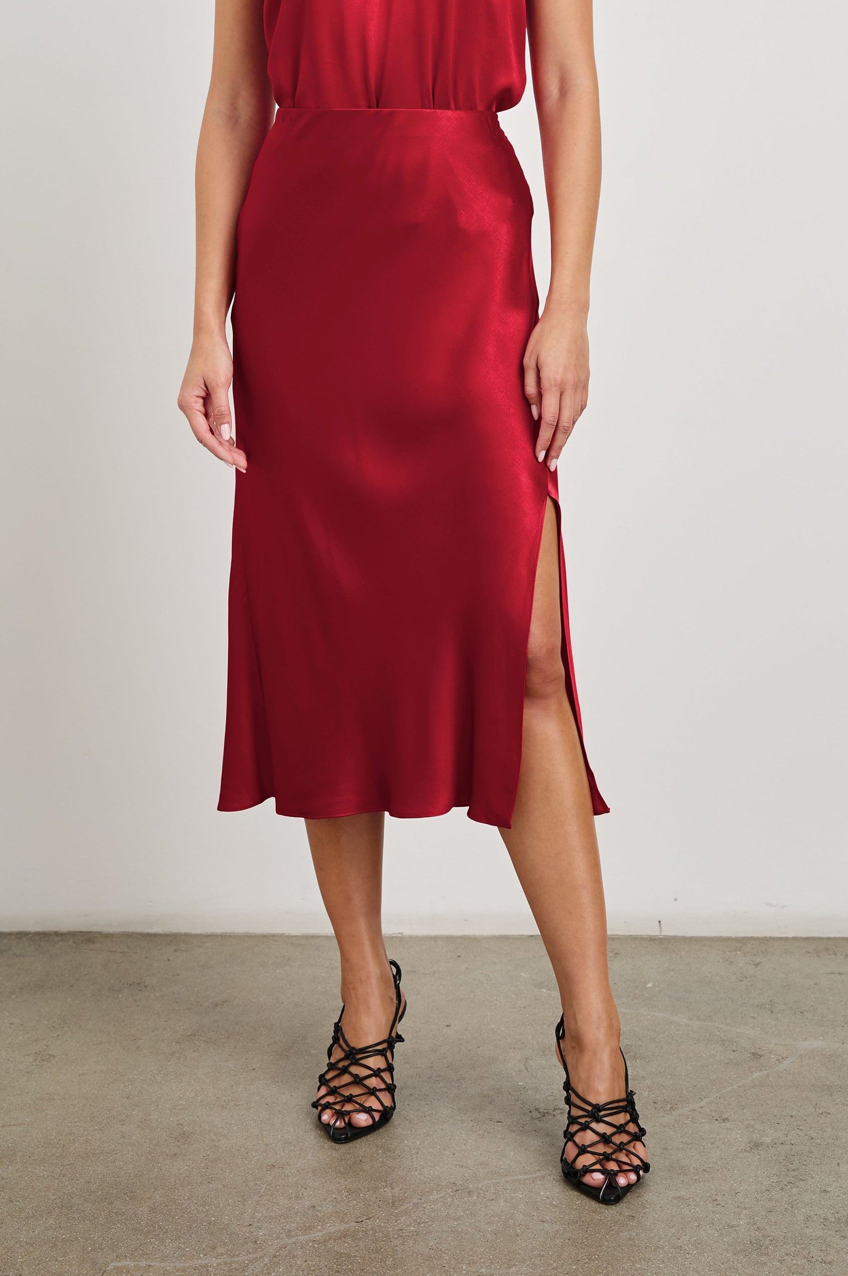 Maya Midi Skirt with Mid-Thigh Side Slit in Scarlet Colorway - Front View Featured on Model