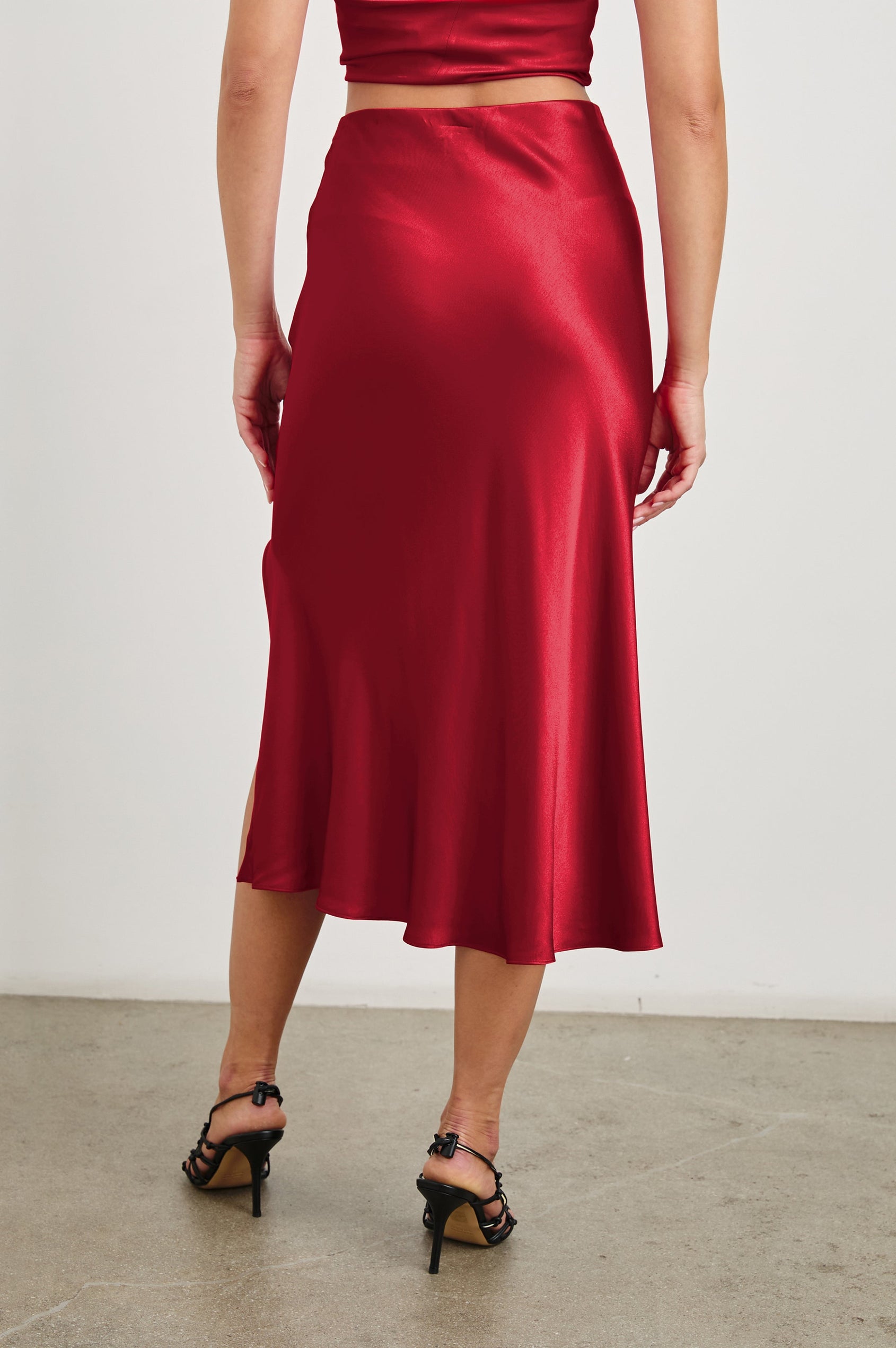 Maya Midi Skirt with Mid-Thigh Side Slit in Scarlet Colorway - Back View Featured on Model