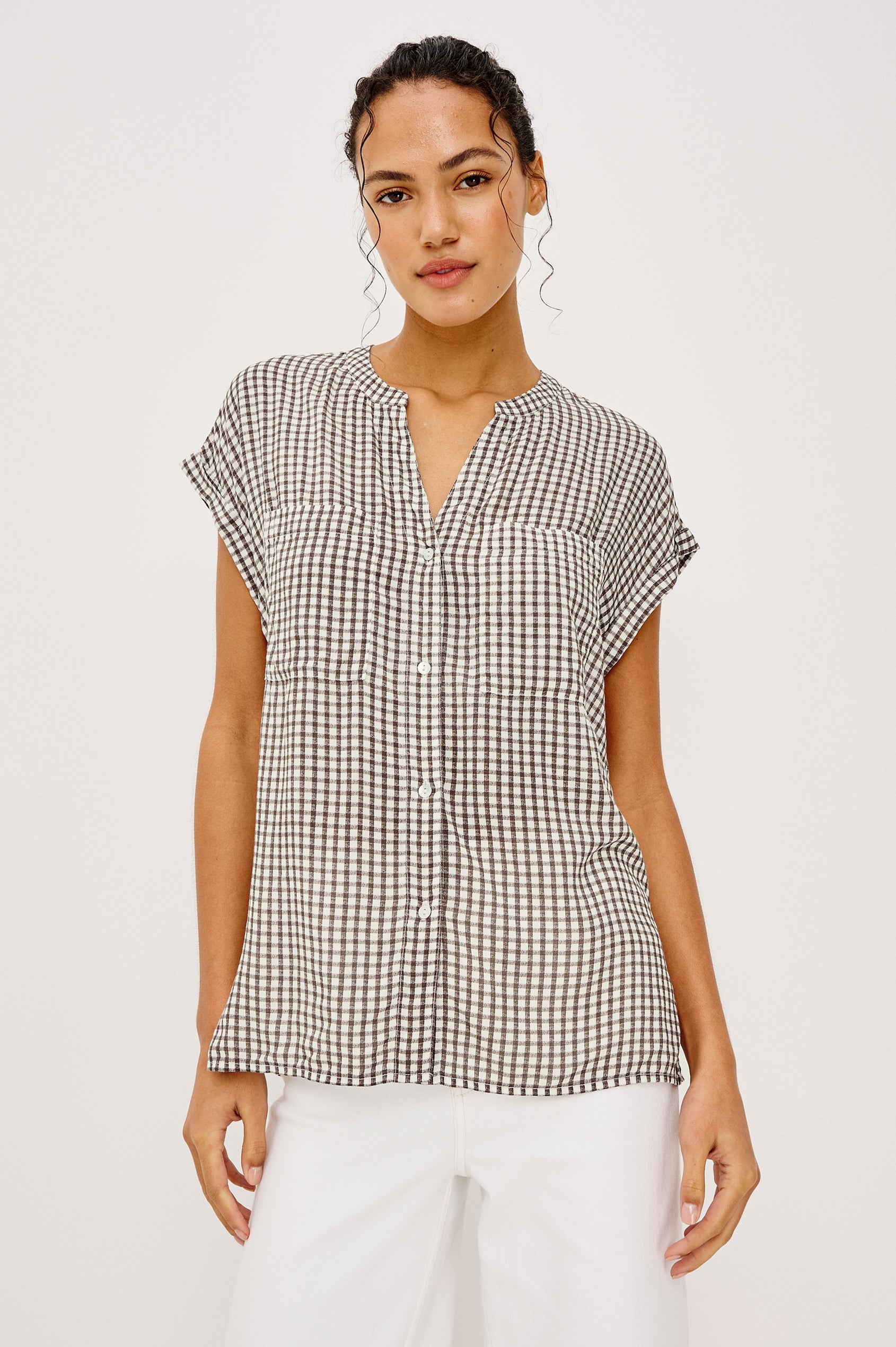 Mel Boxy Button-Up Shirt With Ruffled Cap Sleeves Banded V-Neckline Front Buttons Chest Patch Pockets and Curved High Neckline in Espresso Gingham - Full Body Front View Featured on Model