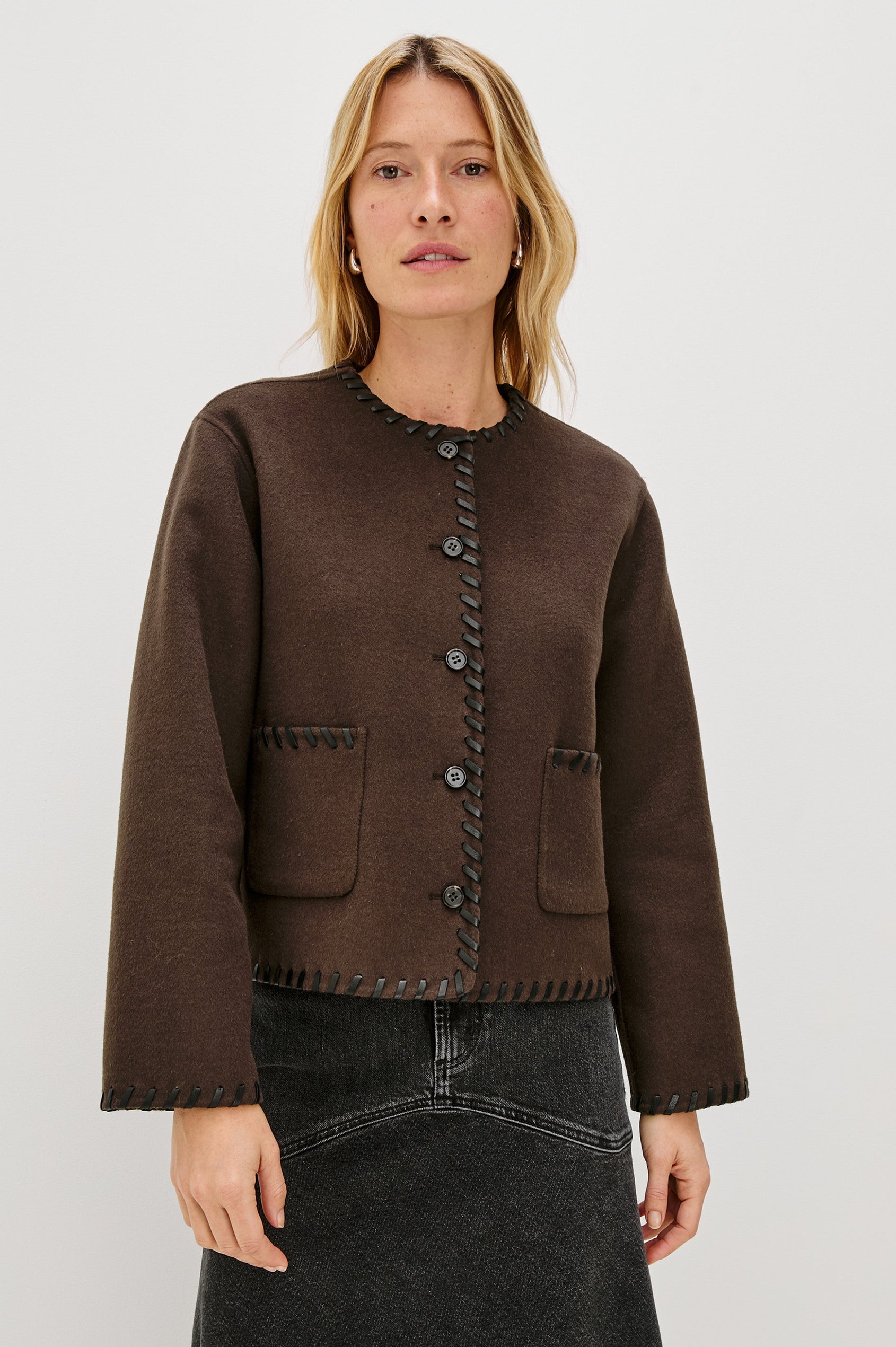 Melanie Jacket with Button Closure and Two Front Patch Pockets in Dark Brown Colorway, with Leather Whipstitching along the Trim and Pockets - Front View Featured on Model