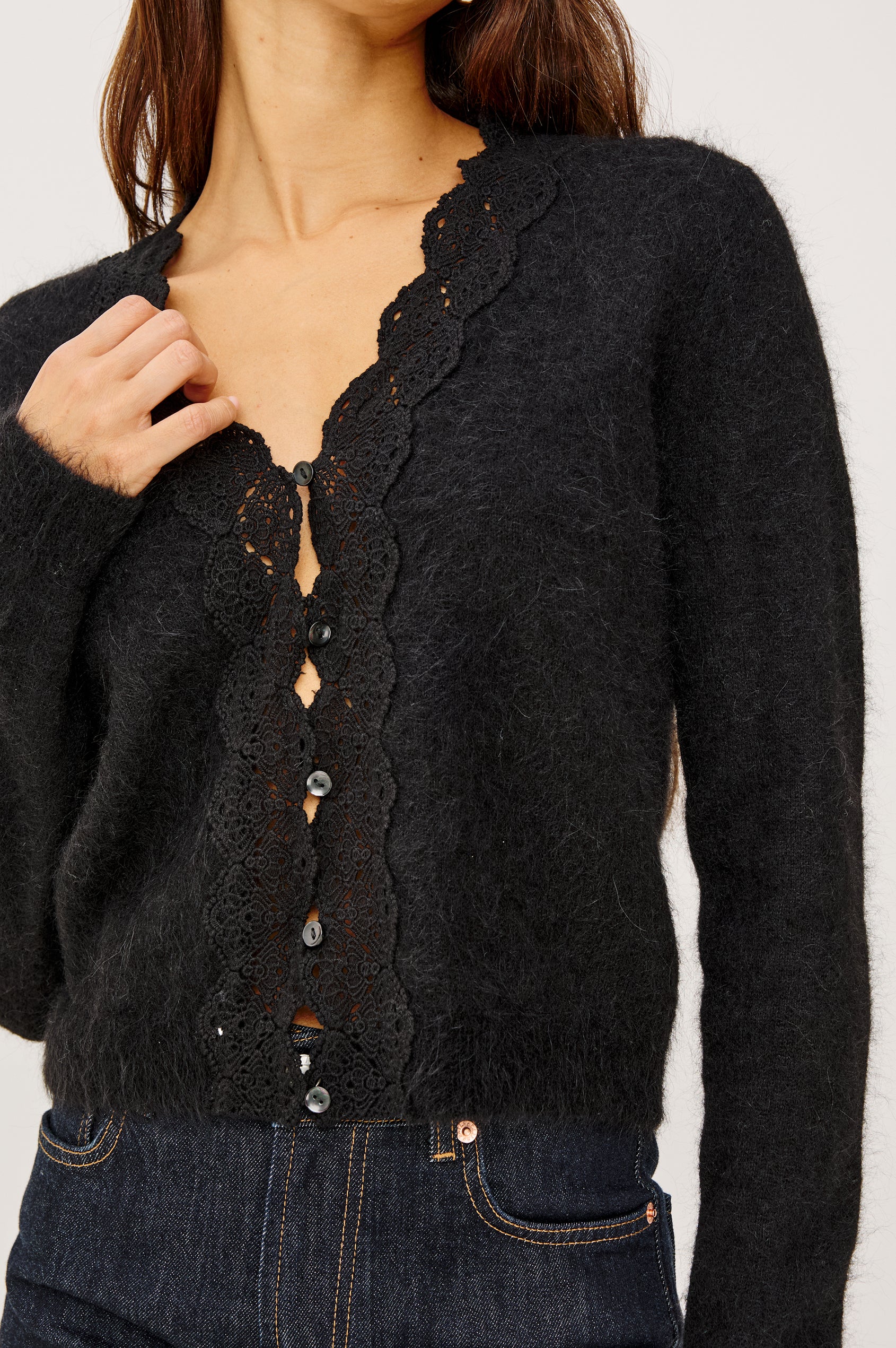 Mer Cardigan Sweater in Alpaca Wool Blend Knit With Lace Trim V-Neckline, Front Buttons, and Long Sleeves in Black Colorway - Upper Body Front View Featured on Model