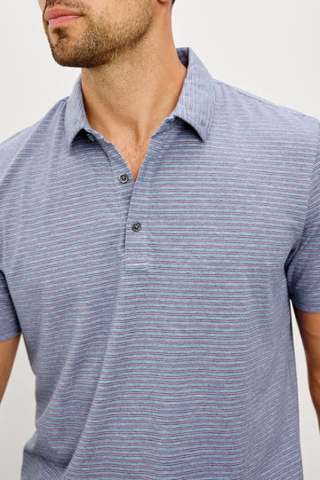 Merced Golf Polo in TENCEL™ Poly Blend With Collar, Quarter Placket, Short Sleeves, and Classic Fit in Hibiscus Mirage Stripe Colorway - Upper Body Front View Featured on Model