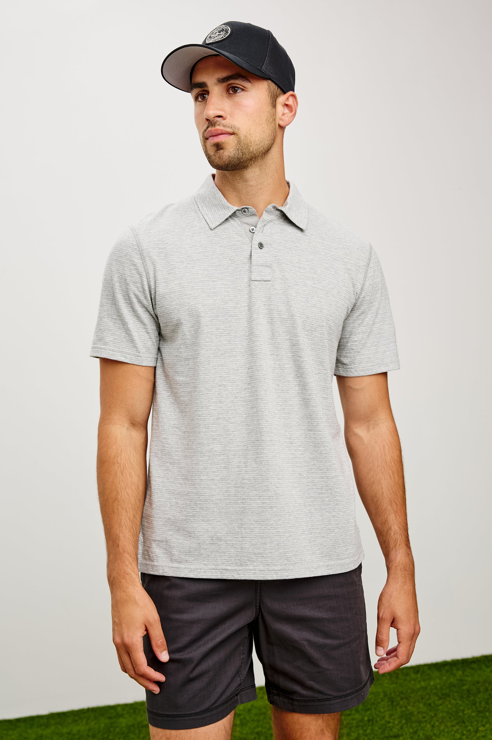 Merced Golf Polo in TENCEL™ Poly Blend With Collar, Quarter Placket, Short Sleeves, and Classic Fit in Heather Grey Stripe Colorway - Upper Body Front View Featured on Model