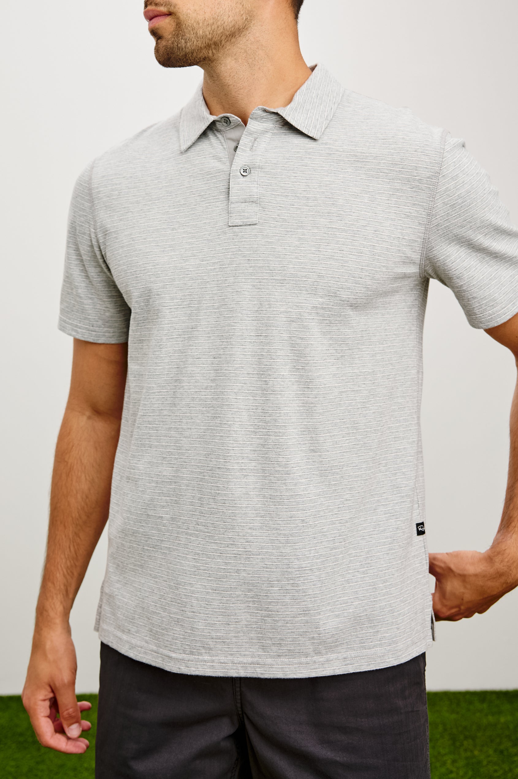 Merced Golf Polo in TENCEL™ Poly Blend With Collar, Quarter Placket, Short Sleeves, and Classic Fit in Heather Grey Stripe Colorway - Upper Body Front View Featured on Model