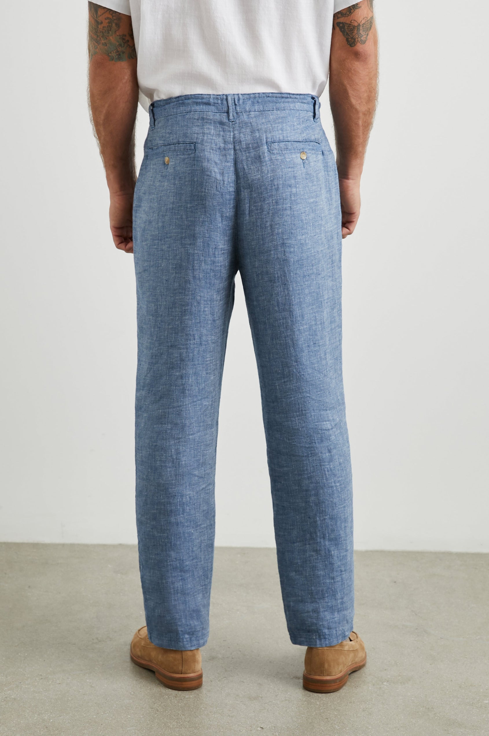 Mercer Pants with a Button and Drawcord Waist, Belt Loops, Two Front Pockets and Two Back Button Welt Pockets in Blue Mirage Colorway - Back View Featured on Model