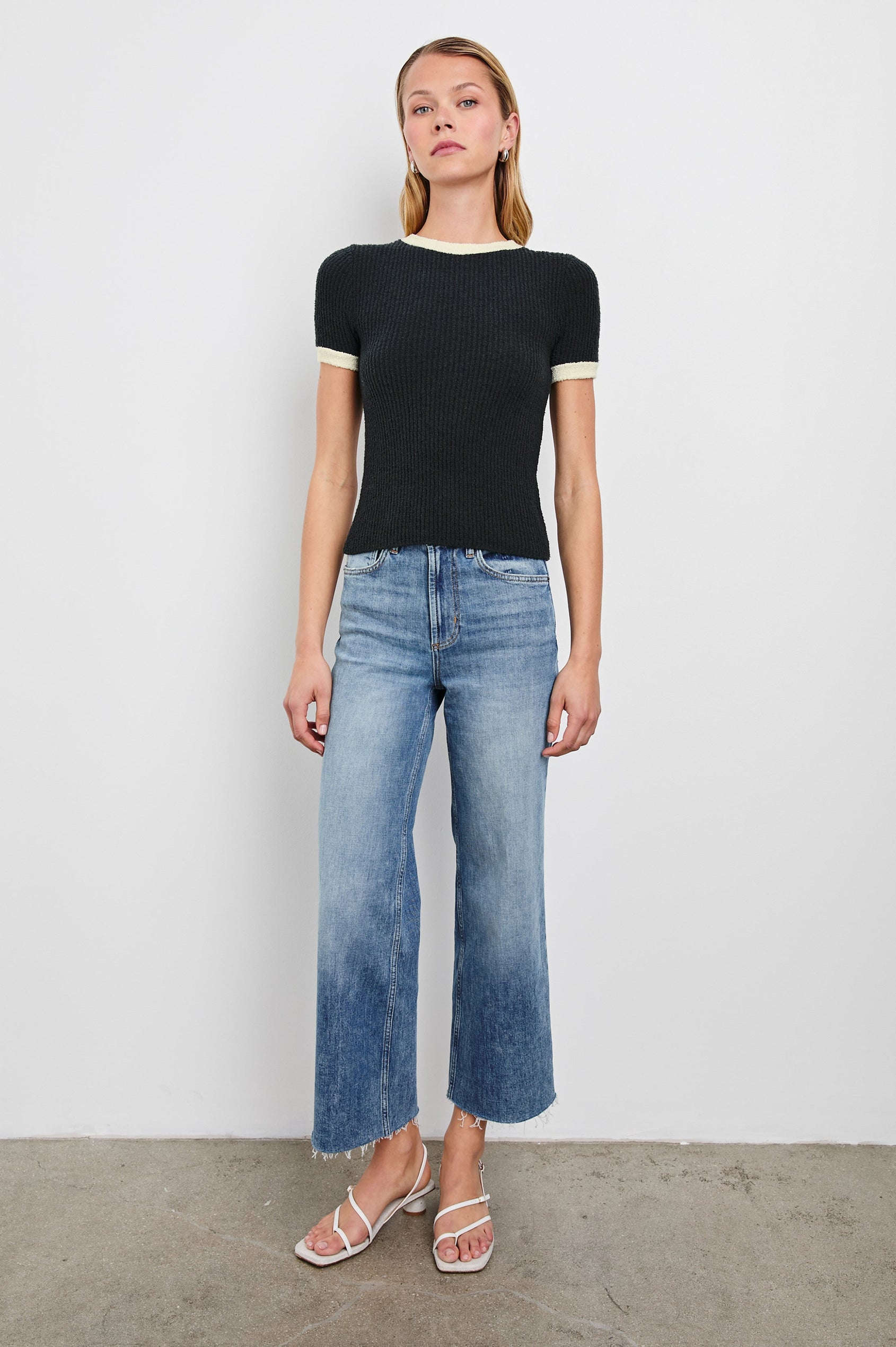 Meredith Short-Sleeve Ribbed Top with Crew Neckline in Black Ivory Colorway, with Ivory trim at the Neckline and Cuffs - Front Full Body View Featured on Model 