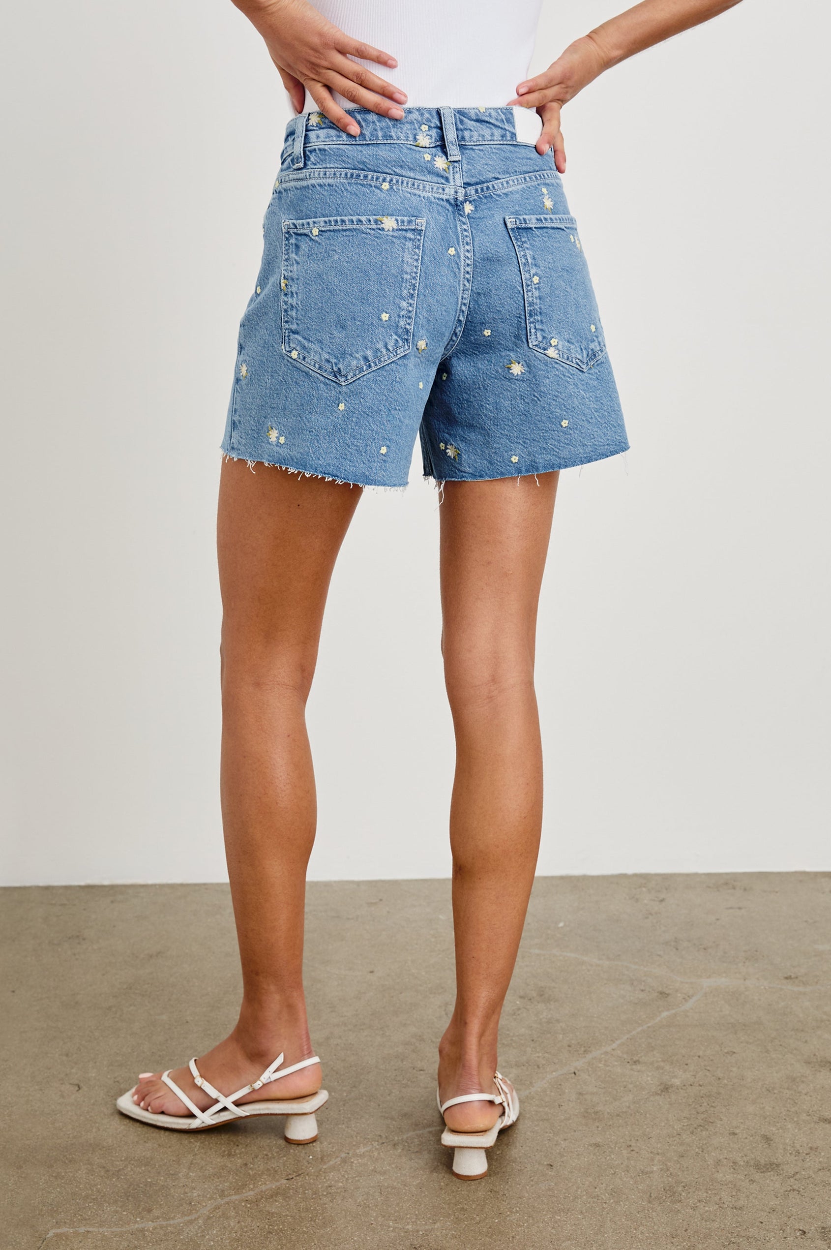 Mesa Indigo Mid Length Short with Pockets and Daisy Embroidery - On model, back lower half of body