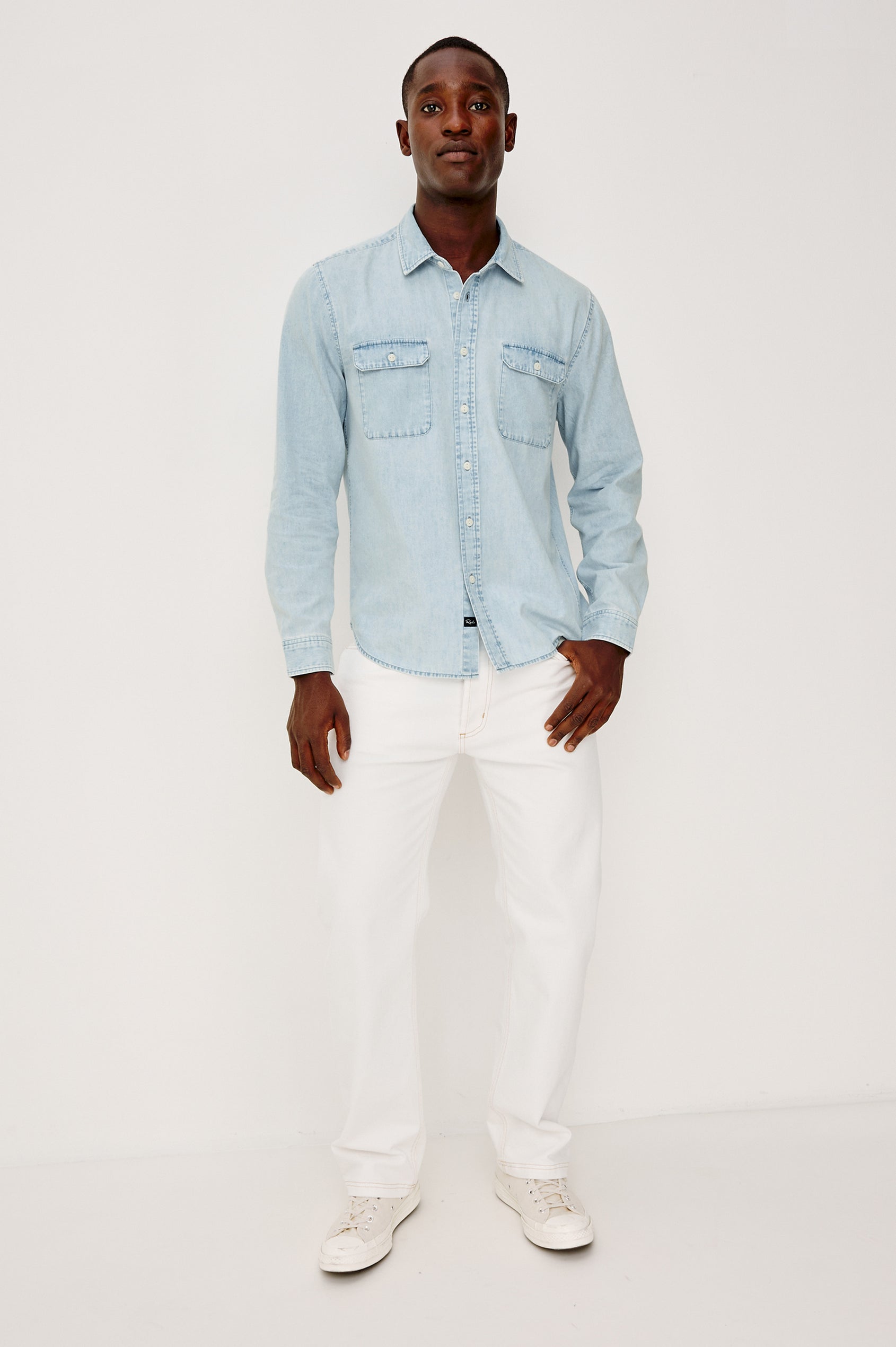 Meyer Shirt in Denim With Collar, Long Sleeves, and Chest Buttoned Flap Pockets in Light Vintage Wash - Full Body Front View Featured on Model