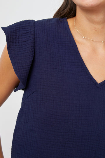 Miley Cropped, Short-Sleeve, V Neck Top with Flutter Sleeves and Textured Fabric in Admiral Blue Colorway - Front View Featured on Model