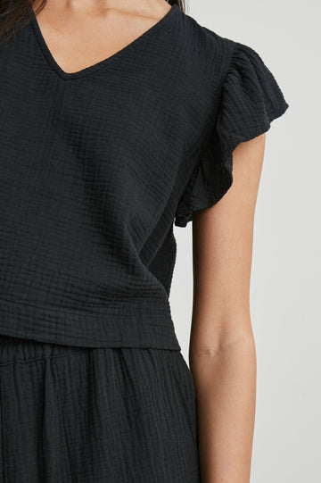 Miley Cropped, Short-Sleeve, V Neck Top with Flutter Sleeves and Textured Fabric in Black Colorway - Front View Featured on Model