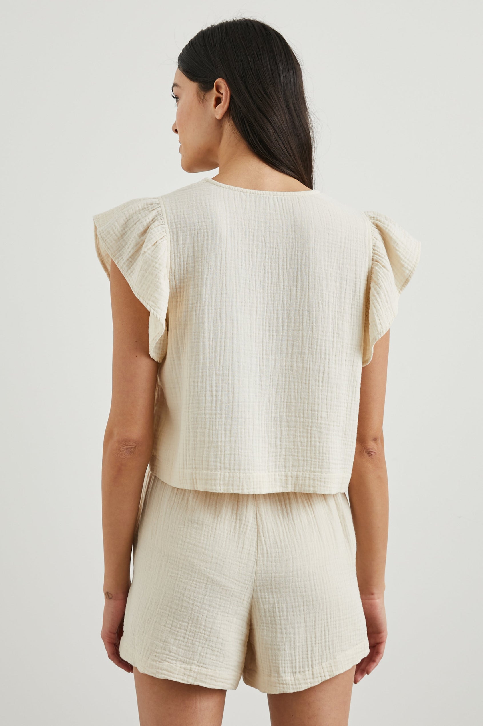 Miley Cropped, Short-Sleeve, V Neck Top with Flutter Sleeves and Textured Fabric in Flex Colorway - Back View Featured on Model