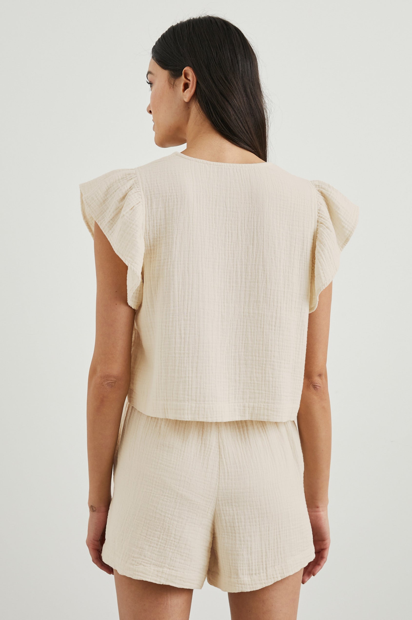 Miley Cropped, Short-Sleeve, V Neck Top with Flutter Sleeves and Textured Fabric in Flex Colorway - Back View Featured on Model