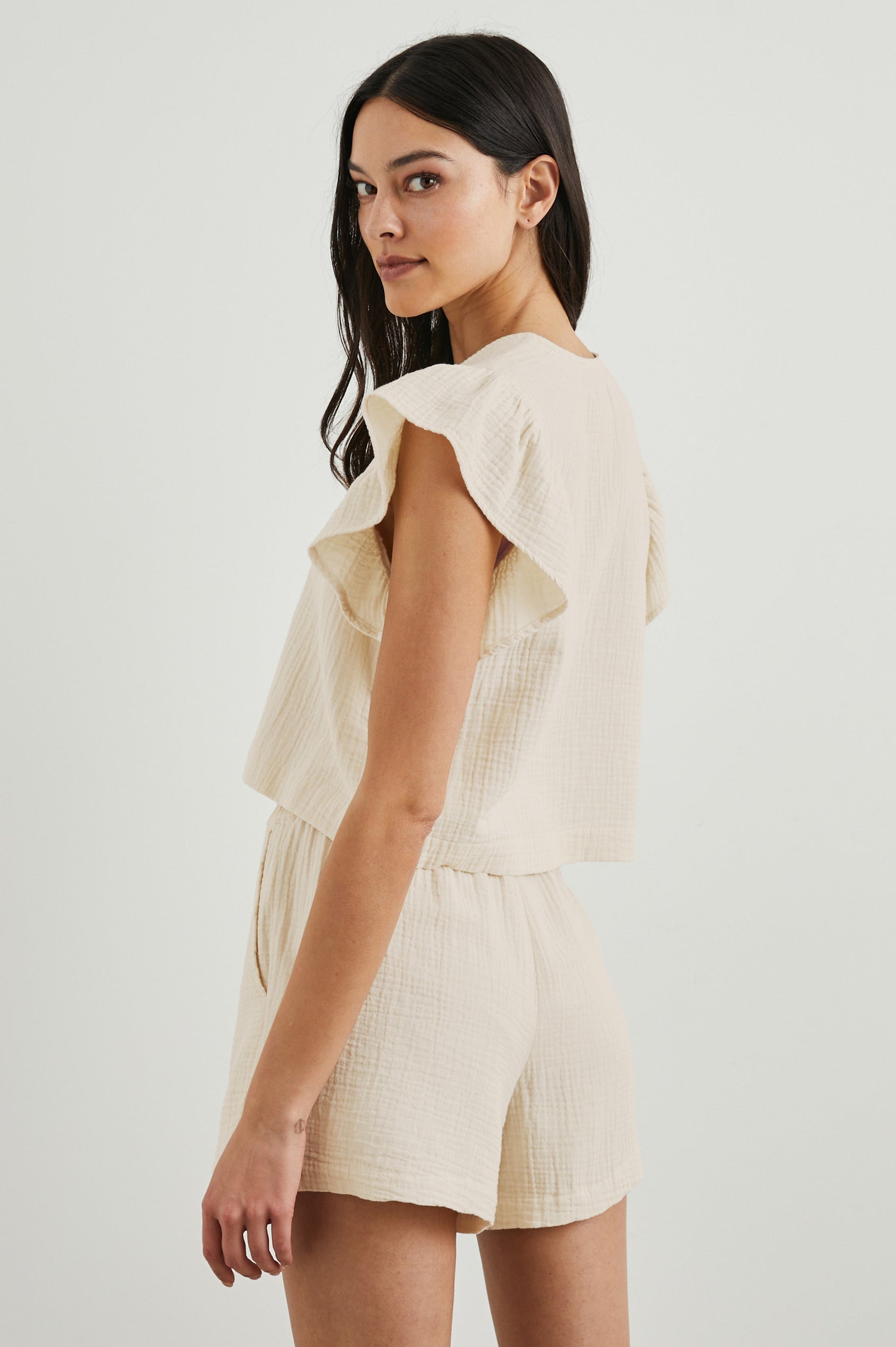 Miley Cropped, Short-Sleeve, V Neck Top with Flutter Sleeves and Textured Fabric in Flex Colorway - Side View Featured on Model