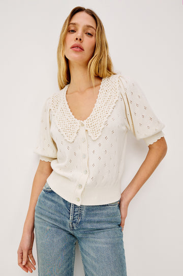Mindy Cardigan Top in Cotton Wool Blend With Crochet Peter Pan Collar, Short Puff Sleeves, and Ribbed Trim in Ivory Colorway - Upper Body Front View Featured on Model
