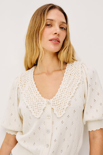 Mindy Cardigan Top in Cotton Wool Blend With Crochet Peter Pan Collar, Short Puff Sleeves, and Ribbed Trim in Ivory Colorway - Upper Body Front View Featured on Model