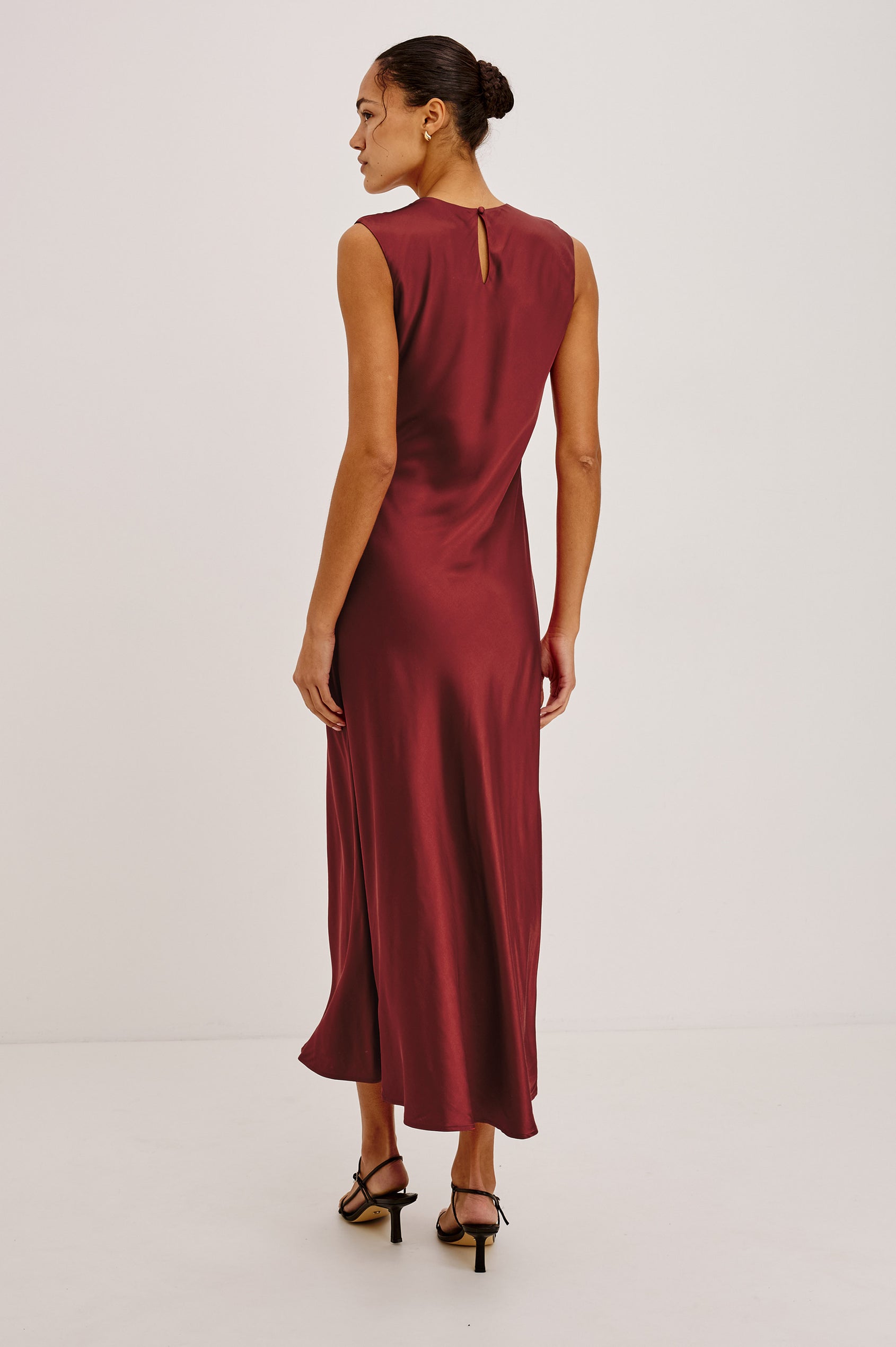 Mira Maxi Dress Bias Cut in Satin-Back Crepe With Crew Neckline, Pleated Shoulders, Side Zipper, and Keyhole Back With Button-Loop Closure in Crimson Colorway - Full Body Back View Featured on Model