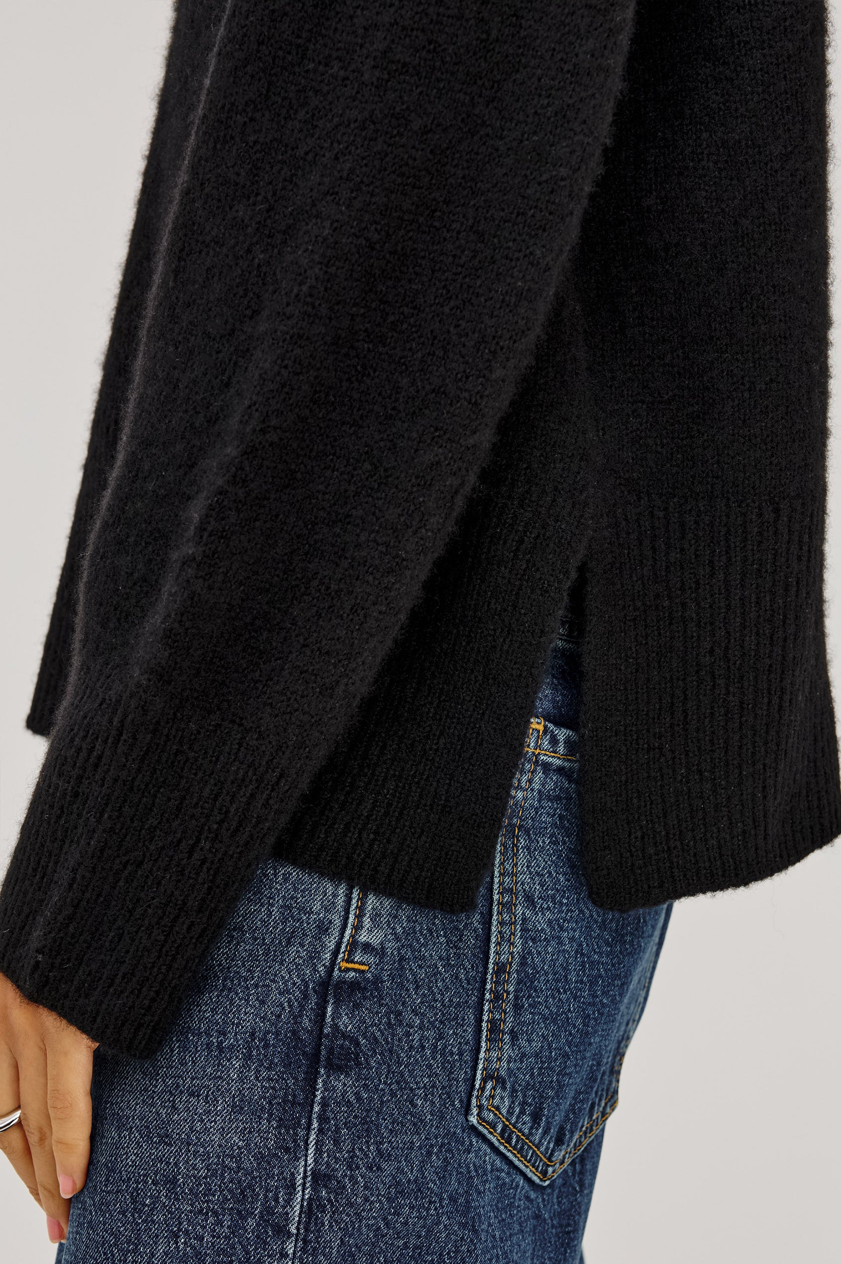 Miranda Sweater in Cashmere-Silk Blend With Crew Neckline, Ribbed Trim, Dropped Shoulders, Loose Relaxed Fit, and Long Sleeves in Black Colorway - Detail Side View Featured on Model