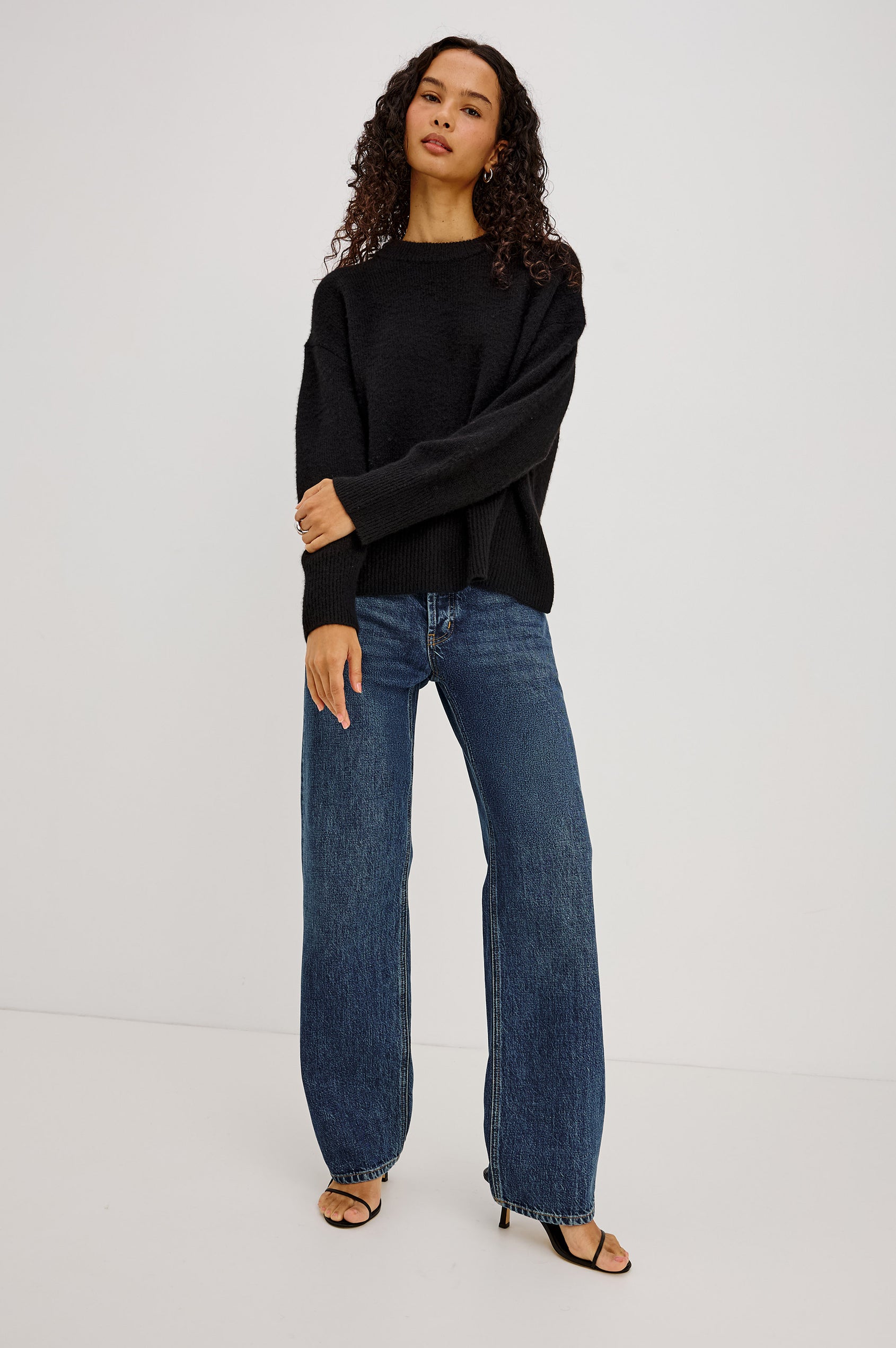Miranda Sweater in Cashmere-Silk Blend With Crew Neckline, Ribbed Trim, Dropped Shoulders, Loose Relaxed Fit, and Long Sleeves in Black Colorway - Full Body Front View Featured on Model