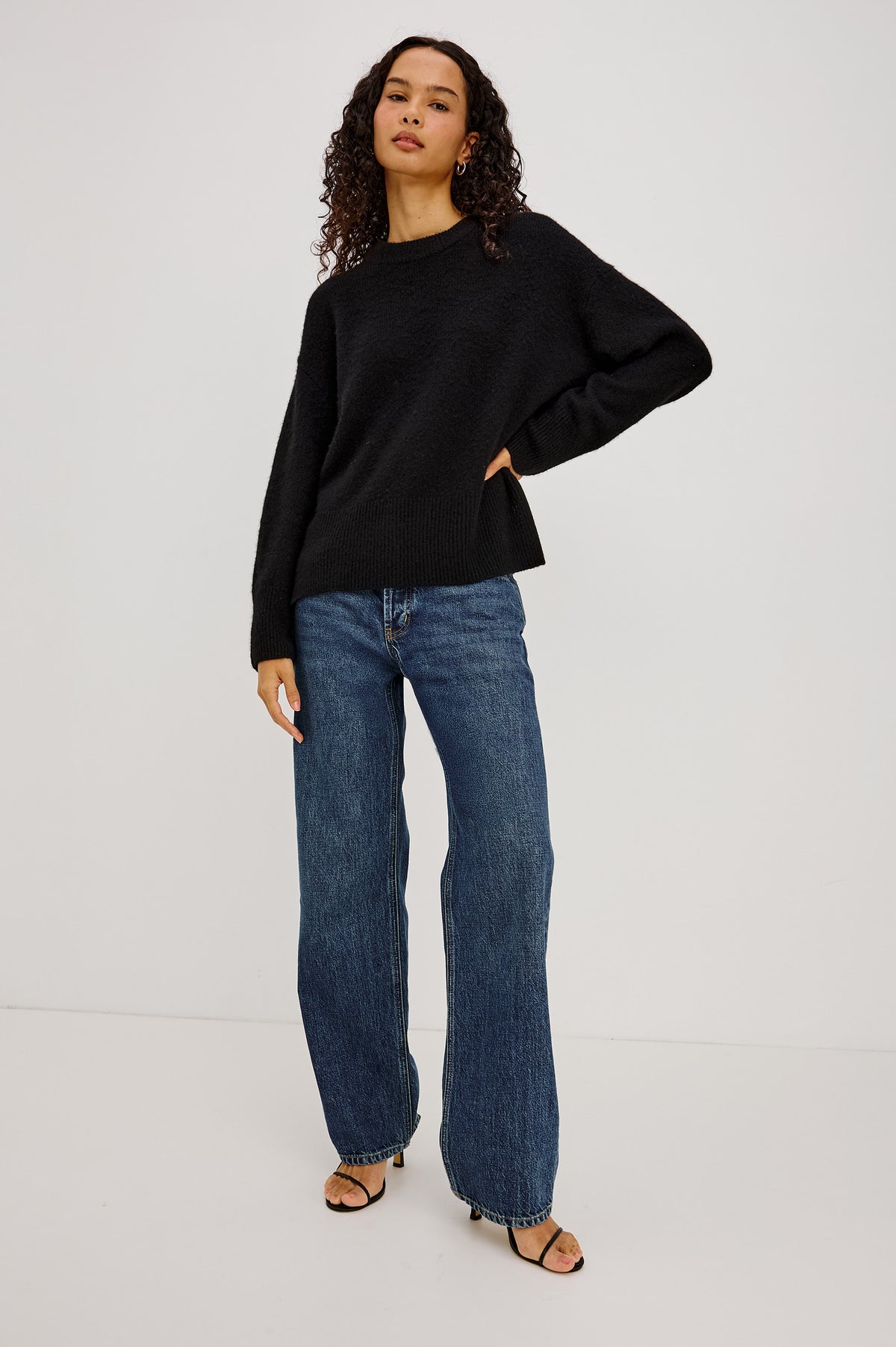 Miranda Sweater in Cashmere-Silk Blend With Crew Neckline, Ribbed Trim, Dropped Shoulders, Loose Relaxed Fit, and Long Sleeves in Black Colorway - Full Body Front View Featured on Model