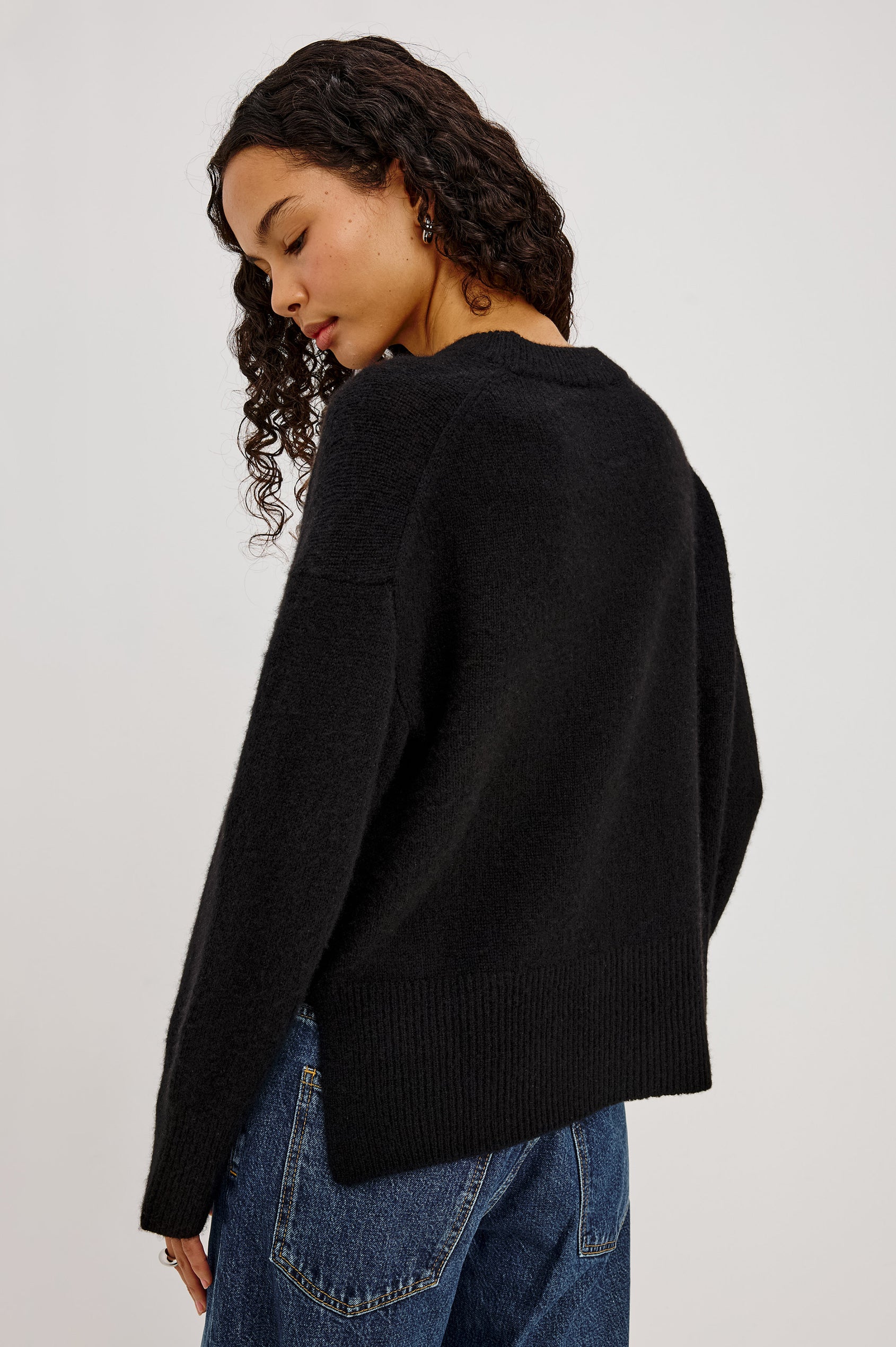 Miranda Sweater in Cashmere-Silk Blend With Crew Neckline, Ribbed Trim, Dropped Shoulders, Loose Relaxed Fit, and Long Sleeves in Black Colorway - Back Crop View Featured on Model