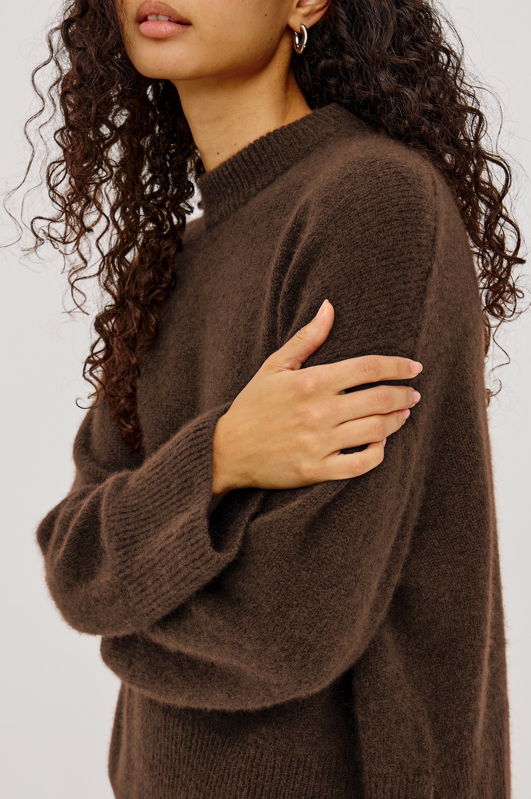 Miranda Sweater in Cashmere-Silk Blend With Relaxed Boxy Fit, Mock Neck, Drop Shoulders, and Side Slits at Hem in Chocolate Colorway - Upper Body Side View Featured on Model