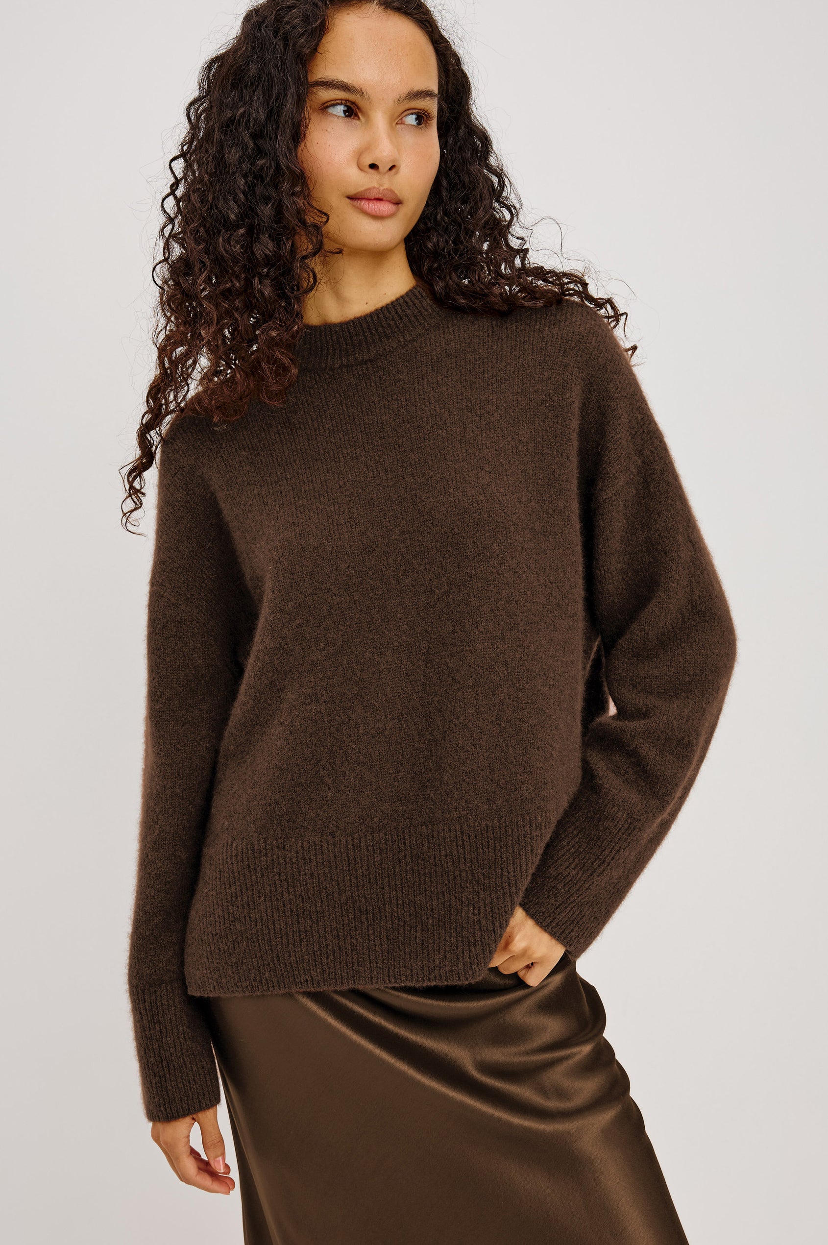 Miranda Sweater in Cashmere-Silk Blend With Crew Neckline, Ribbed Trim, Dropped Shoulders, Loose Relaxed Fit, and Long Sleeves in Chocolate Colorway - Upper Body View Featured on Model