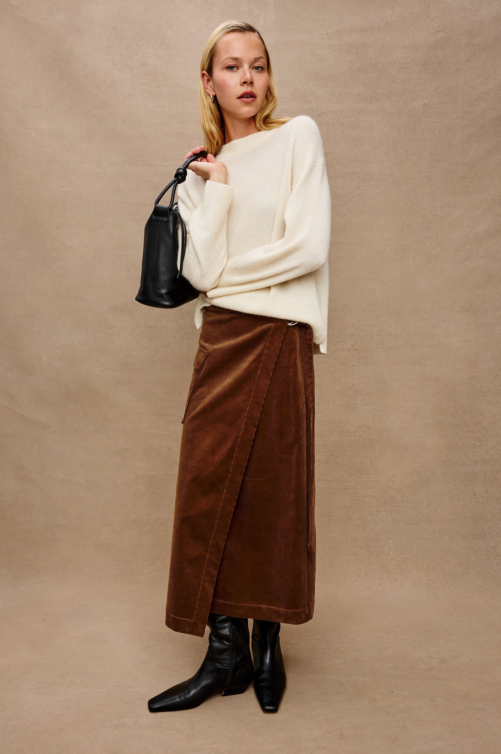 Miranda Long-Sleeve Sweater with a Mock Neck, Side Slits, and Ribbed Trim in Ivory Colorway - Stylized Full Body Front View Featured on Model