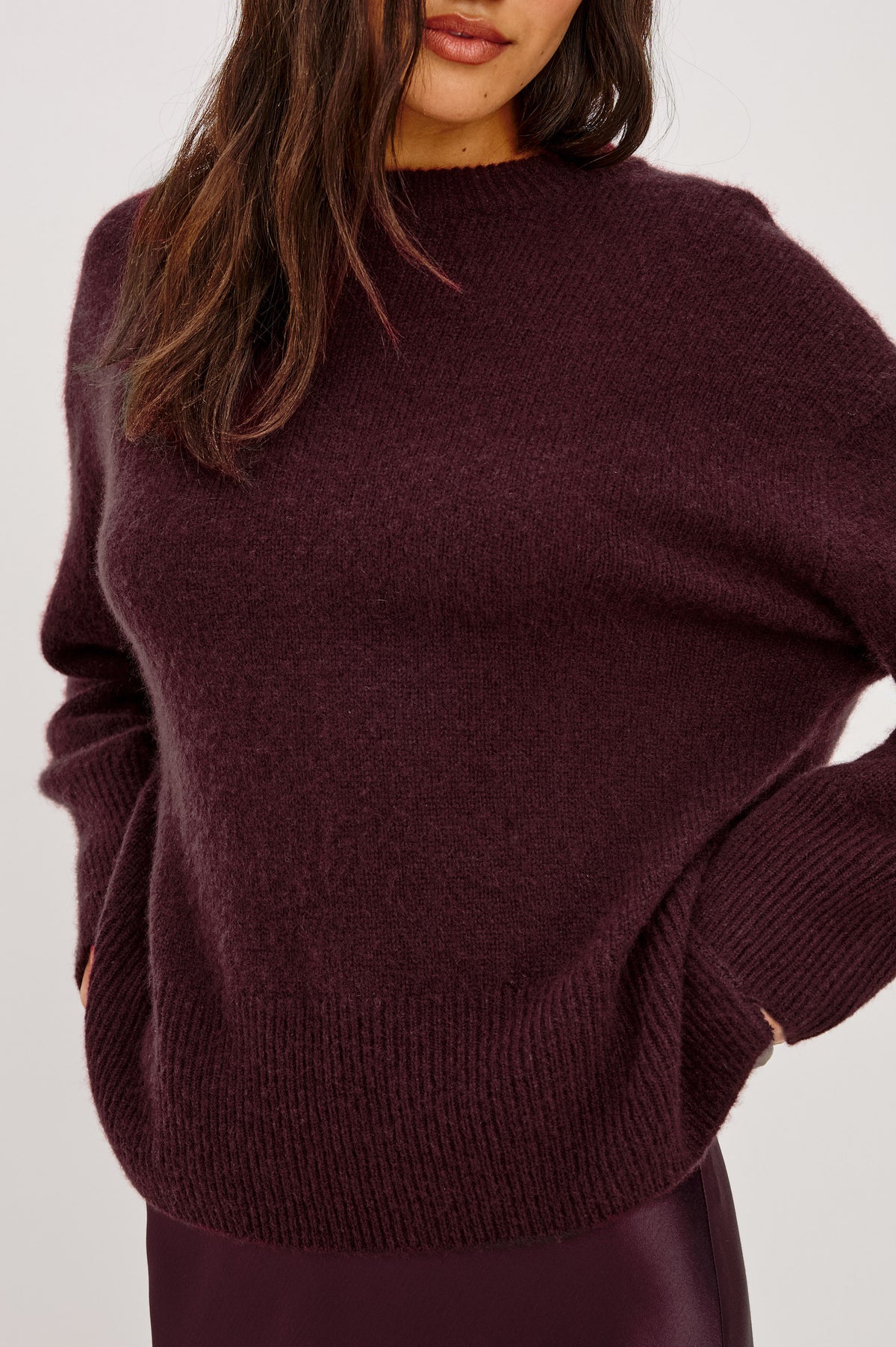 Miranda Sweater in Cashmere-Silk Blend With Relaxed Boxy Fit, Mock Neck, Drop Shoulders, and Side Slits at Hem in Wine Colorway - Detail Front View Featured on Model