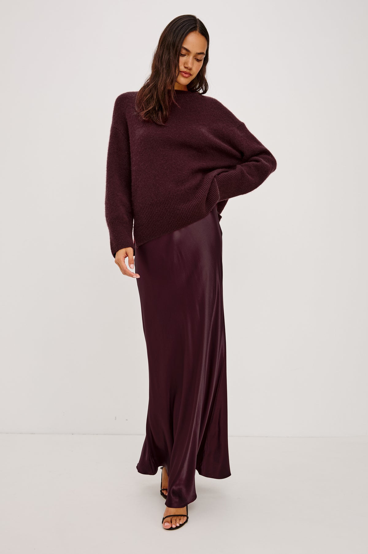 Miranda Sweater in Cashmere-Silk Blend With Relaxed Boxy Fit, Mock Neck, Drop Shoulders, and Side Slits at Hem in Wine Colorway - Front Full Body View Featured on Model