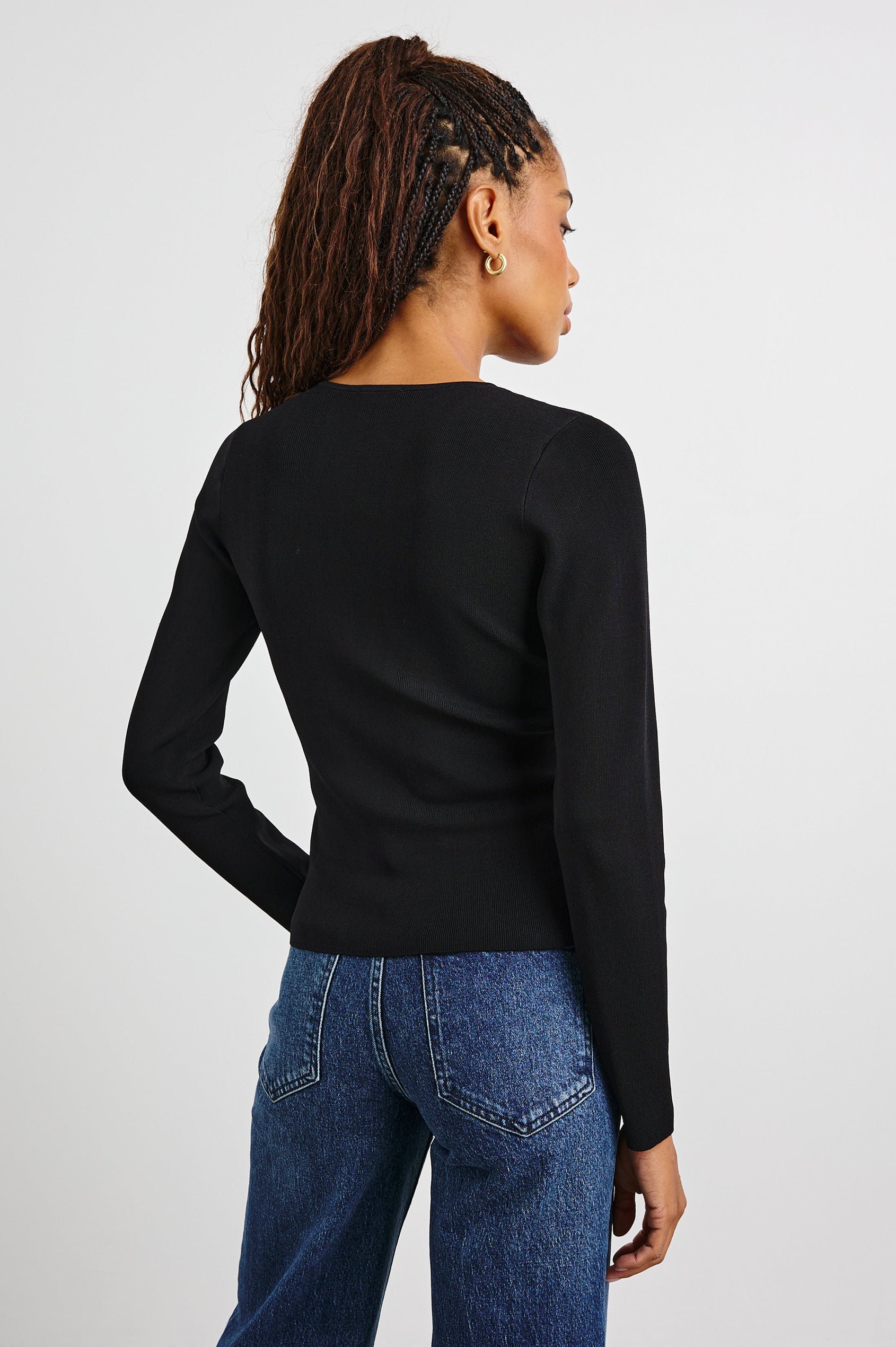 Misa Long-Sleeve Top with a Deep Geometric Cutout in Black Colorway - Back View Featured on Model 