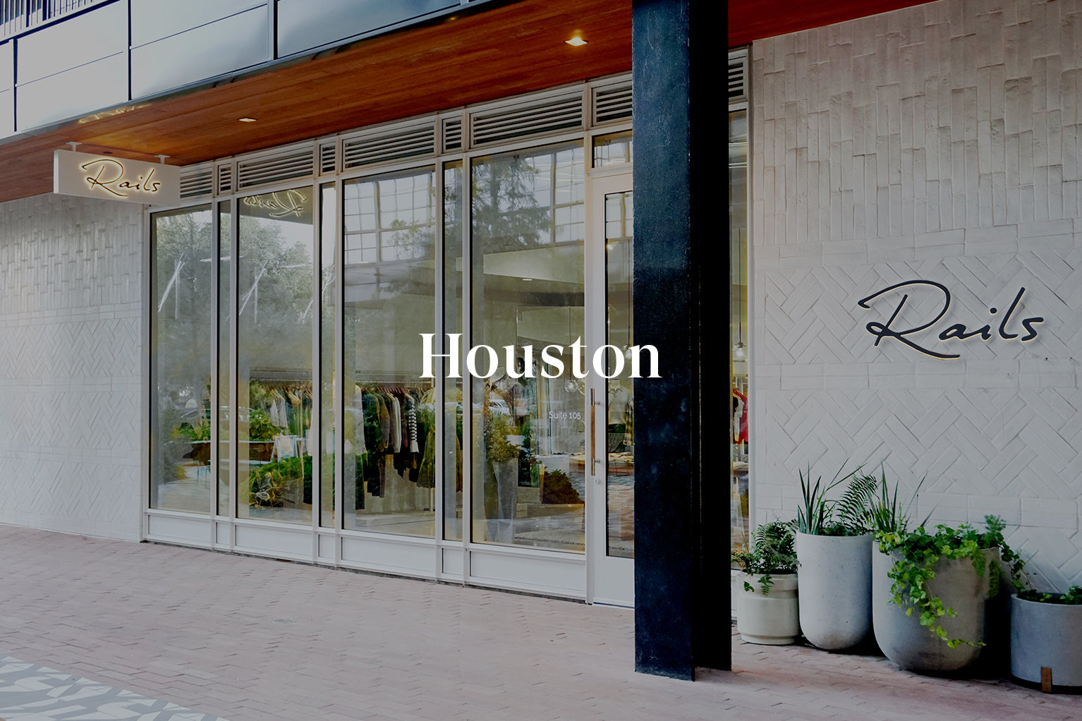 OUTSIDE OF THE HOUSTON STORE SHOWING THE FRONT ENTRANCE AND FRONT WINDOWS (LARGE GLASS DOOR WITH LARGE FLOOR TO CIELING WINDOWS) 
