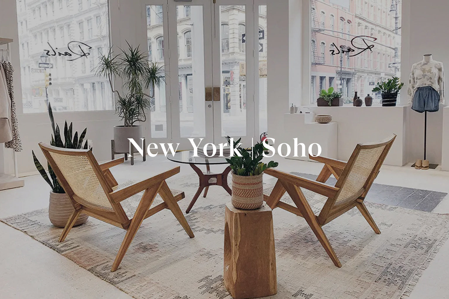 INSIDE OF SOHO STORE SHOWING THE ENTRANCE TO THE FRONT OF THE STORE AND TWO CHAIRS IN THE MIDDLE OF THE STORE