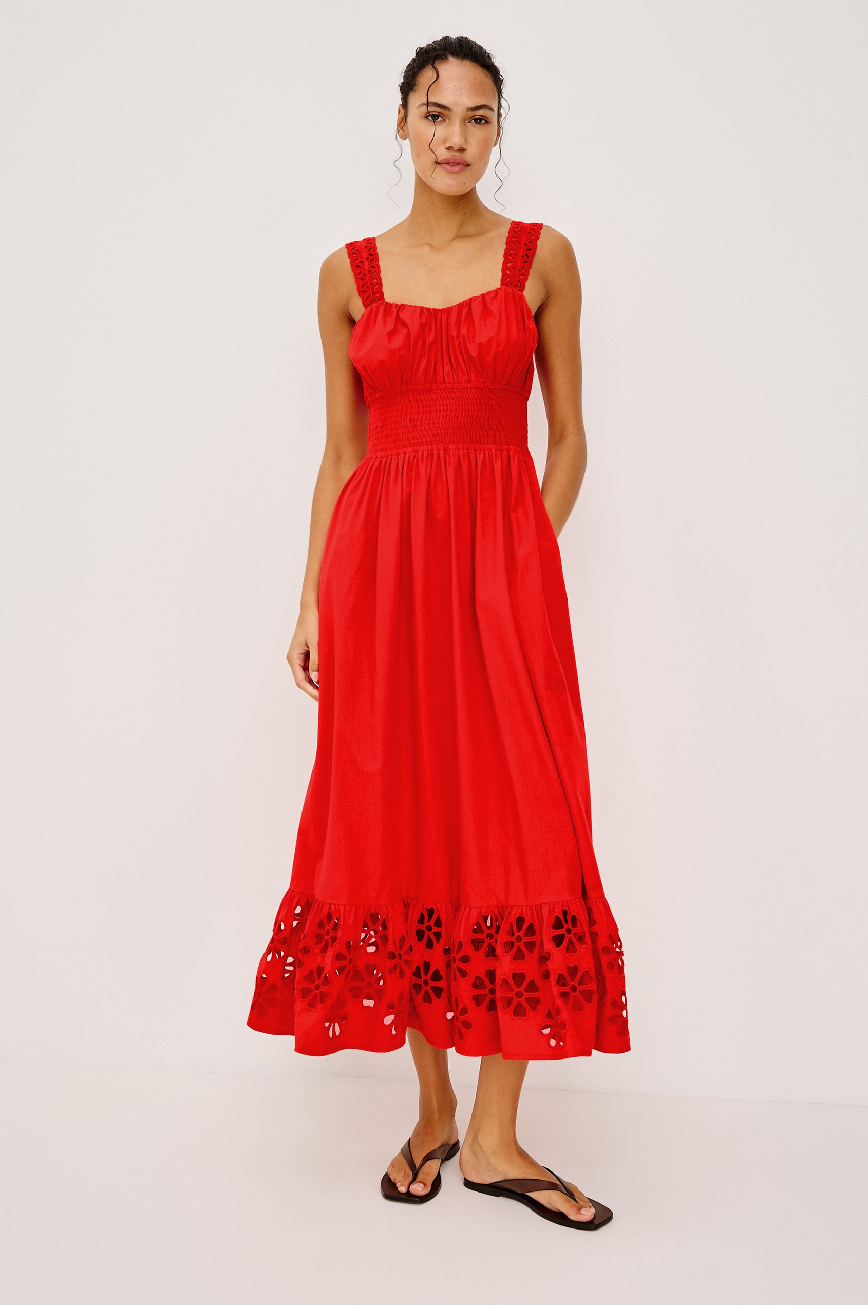 Moira Midi Dress in Cotton Poplin With Wide Embroidered Shoulder Straps Soft Sweetheart Neckline Smocked Empire Waist Fully Lined Skirt With Floral Cutwork at Hem in Scarlet Colorway - Full Body Front View Featured on Model