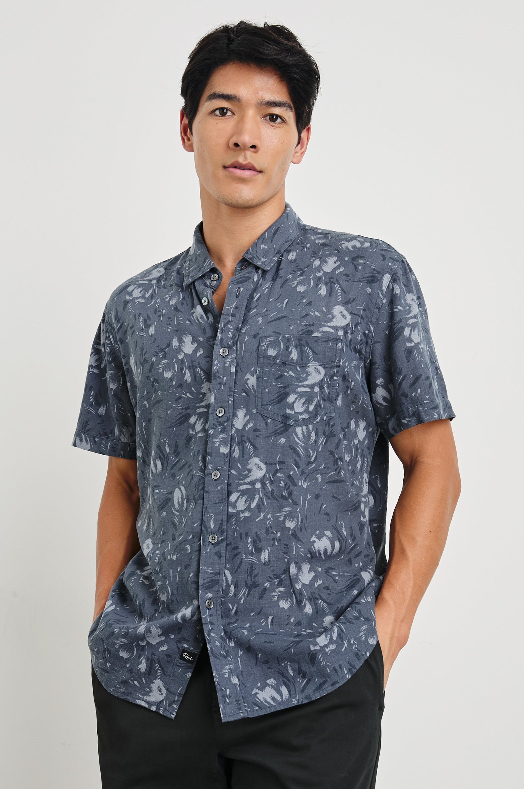 Monaco Short-Sleeve Button Up with a Chest Patch Pocket in Navy Floral Brush Colorway, Abstract Flowers in Blues on Navy - Front View Featured on Model