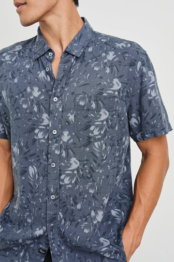 Monaco Short-Sleeve Button Up with a Chest Patch Pocket in Navy Floral Brush Colorway, Abstract Flowers in Blues on Navy - Front View Featured on Model