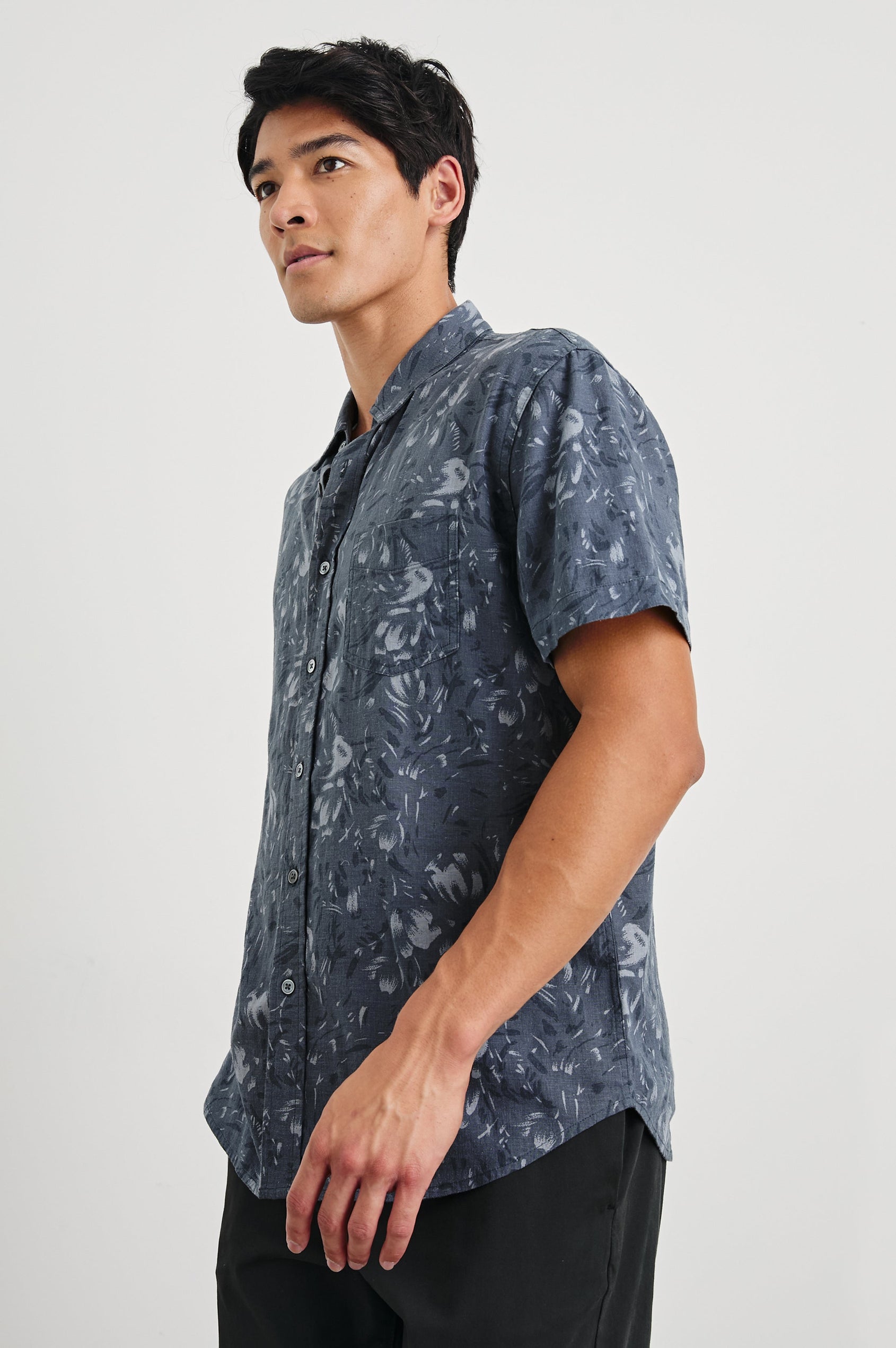 Monaco Short-Sleeve Button Up with a Chest Patch Pocket in Navy Floral Brush Colorway, Abstract Flowers in Blues on Navy - Side View Featured on Model