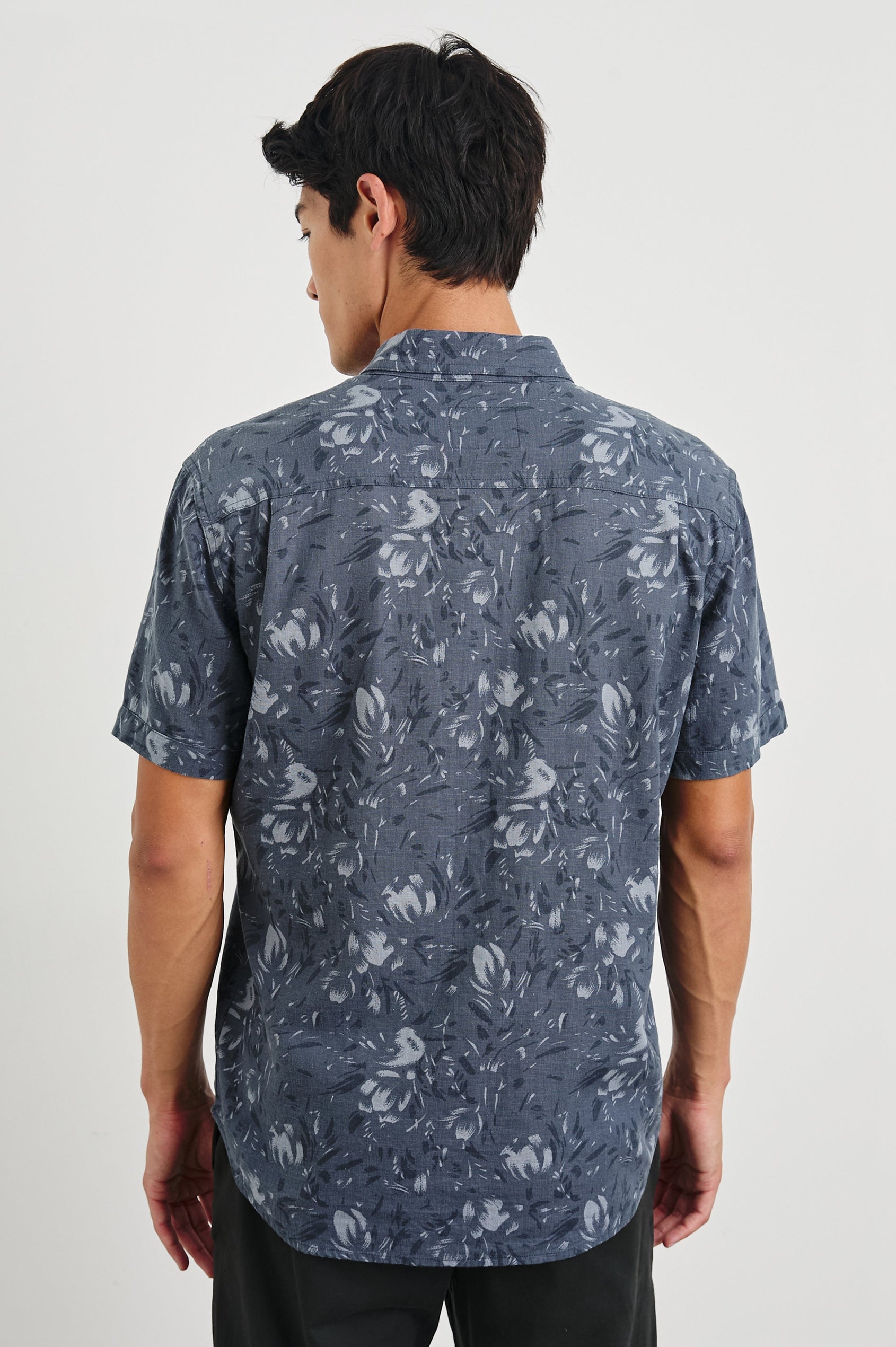 Monaco Short-Sleeve Button Up with a Chest Patch Pocket in Navy Floral Brush Colorway, Abstract Flowers in Blues on Navy - Back View Featured on Model
