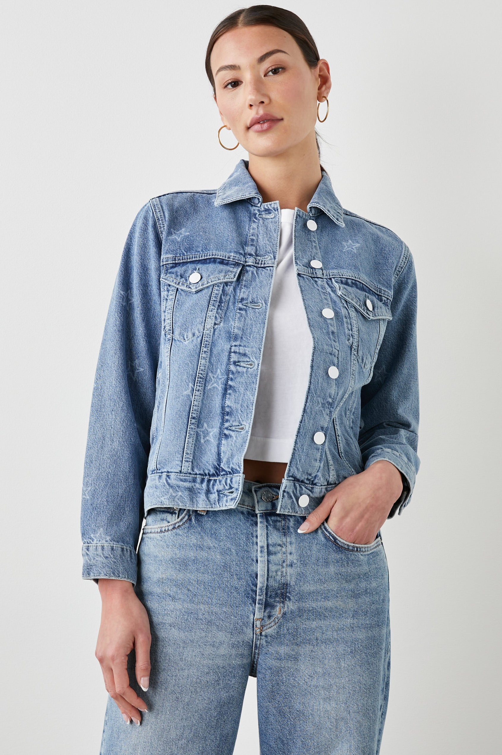 Mulholland Denim Jacket with Button Closure, Two Chest Button Flap Pockets, Two Front Pockets, Adjustable Button Straps on Hem in Lady Liberty Colorway, with White Stars - Front View Featured on Model  