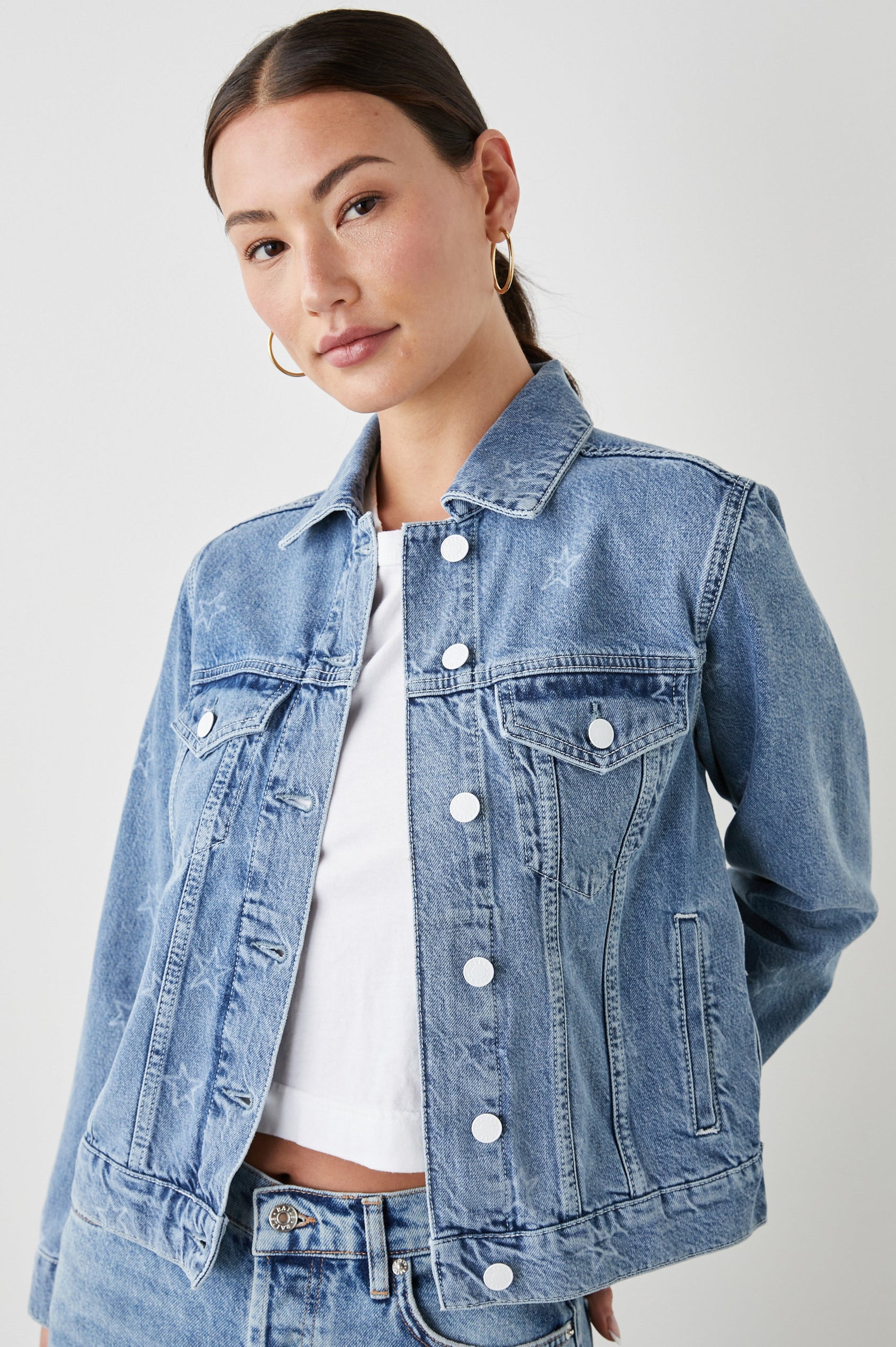 Mulholland Denim Jacket with Button Closure, Two Chest Button Flap Pockets, Two Front Pockets, Adjustable Button Straps on Hem in Lady Liberty Colorway, with White Stars - Front View Featured on Model  