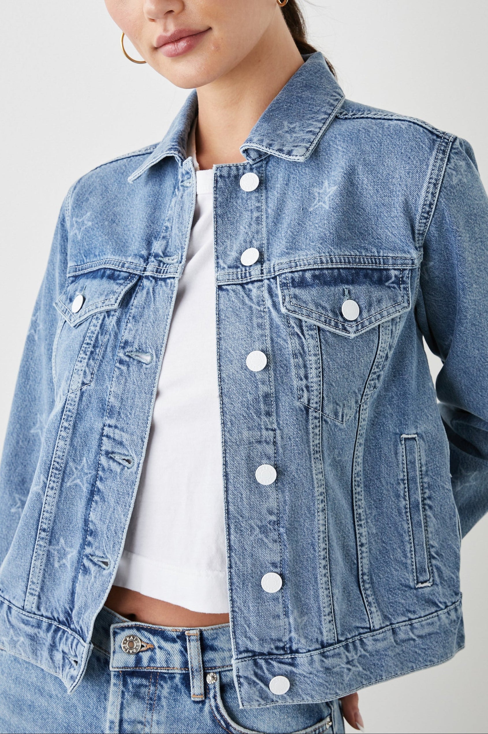 Mulholland Denim Jacket with Button Closure, Two Chest Button Flap Pockets, Two Front Pockets, Adjustable Button Straps on Hem in Lady Liberty Colorway, with White Stars - Front View Featured on Model  